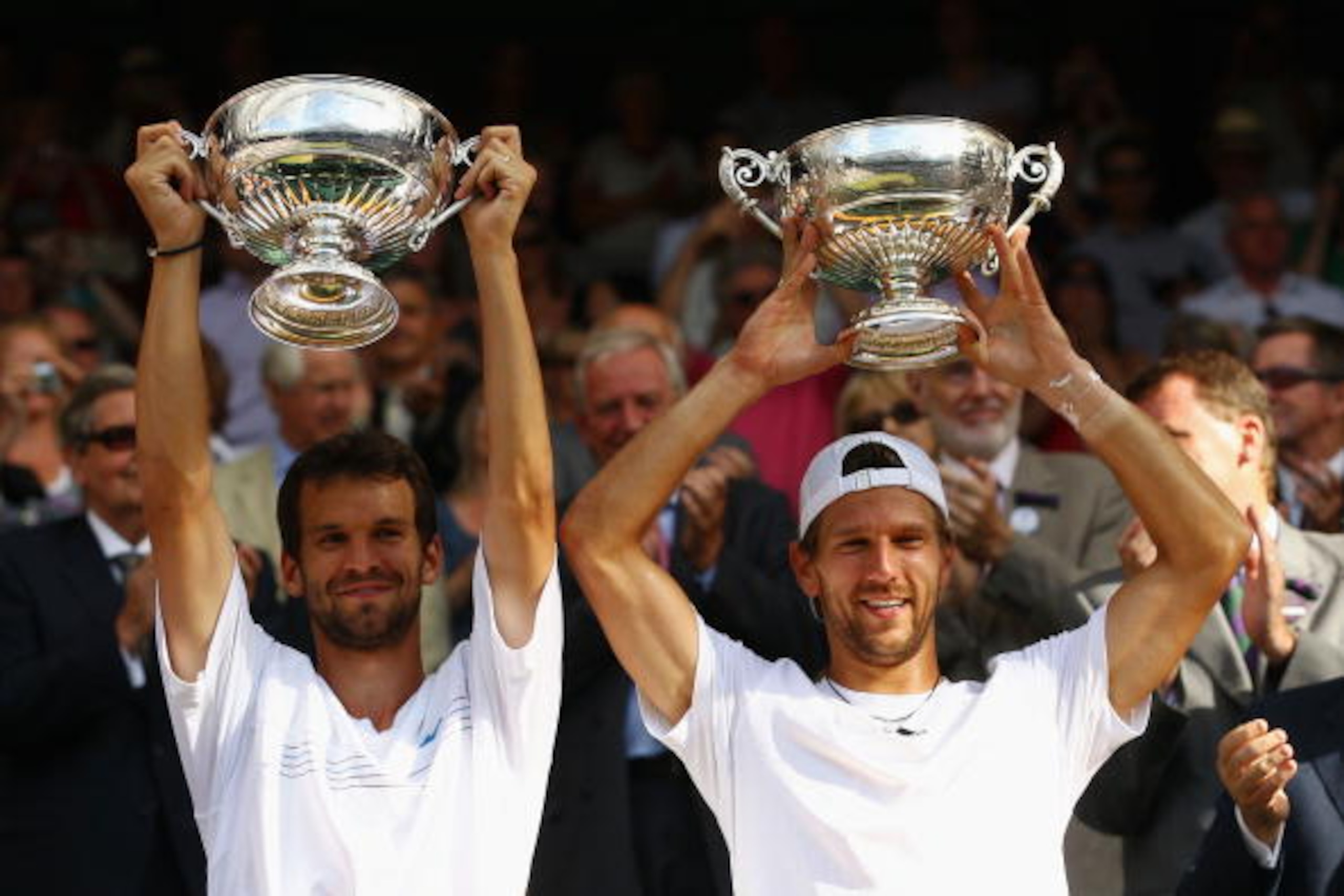 LONDON, ENGLAND - JULY 03: Jurgen Melzer of Austria (R) and Philipp Petzschner of Germany celebrate after winning the Mens Doubles Final against Robert Lindstedt of Sweden and Horia Tecau of Romania on Day Twelve of the Wimbledon Lawn Tennis Championship LONDON, ENGLAND - JULY 03: Jurgen Melzer of Austria (R) and Philipp Petzschner of Germany celebrate after winning the Mens Doubles Final against Robert Lindstedt of Sweden and Horia Tecau of Romania on Day Twelve of the Wimbledon Lawn Tennis Championship