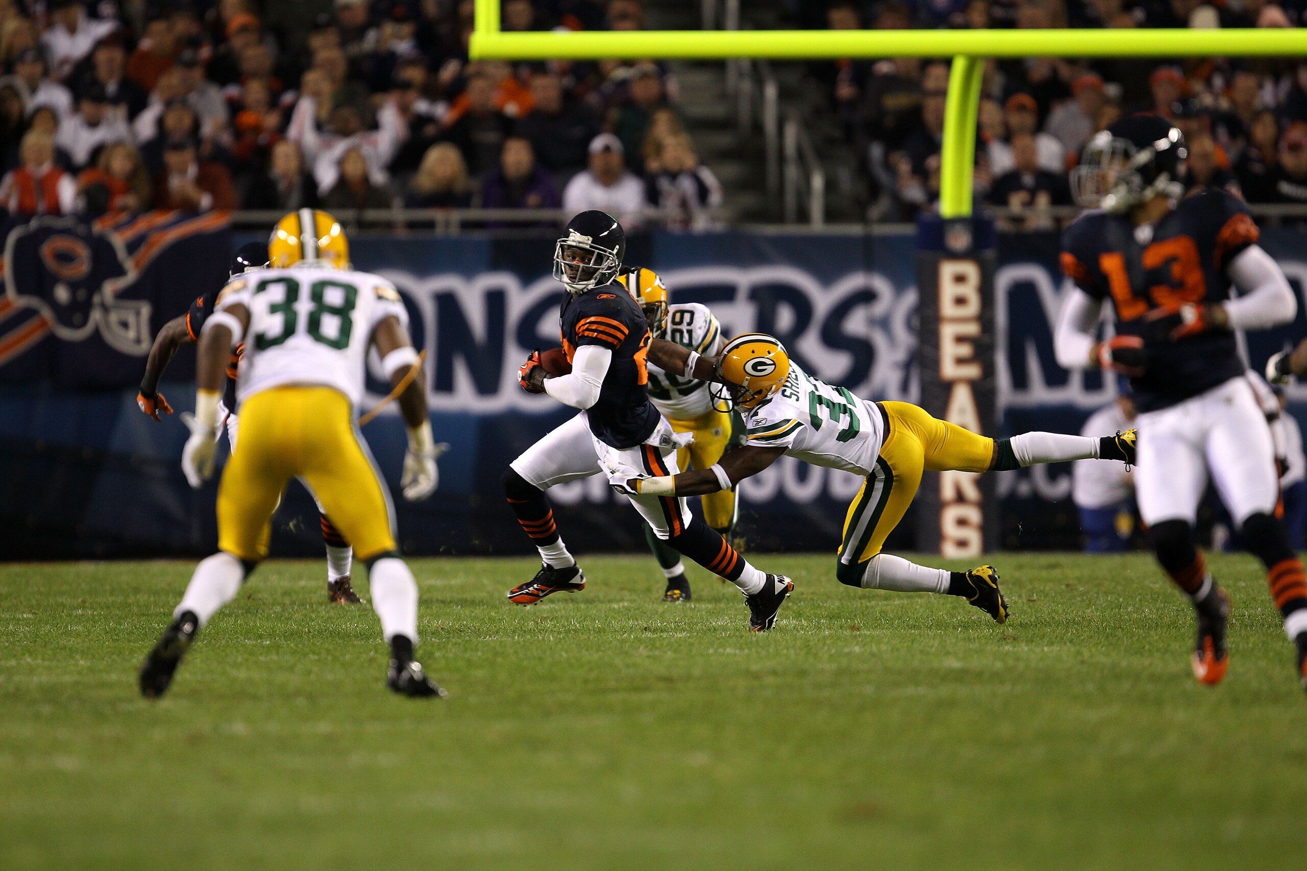 CHICAGO - SEPTEMBER 27:  Devin Hester #23 of the Chicago Bears returns a punt against Sam Shields #37 of the Green Bay Packers at Soldier Field on September 27, 2010 in Chicago, Illinois.  (Photo by Jonathan Daniel/Getty Images)
