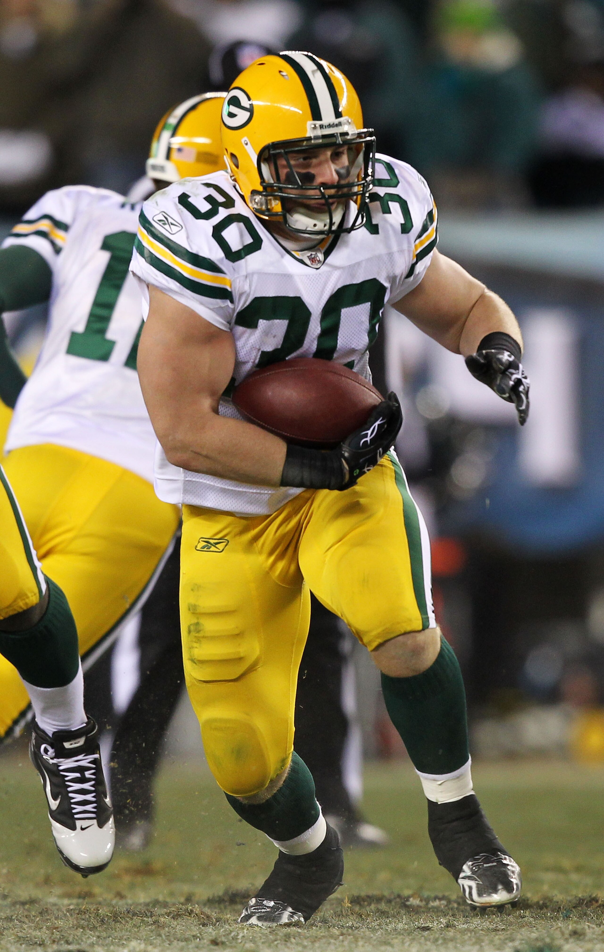 PHILADELPHIA, PA - JANUARY 09:  John Kuhn #30 of the Green Bay Packers runs down field against the Philadelphia Eagles during the 2011 NFC wild card playoff game at Lincoln Financial Field on January 9, 2011 in Philadelphia, Pennsylvania.  (Photo by Al Be
