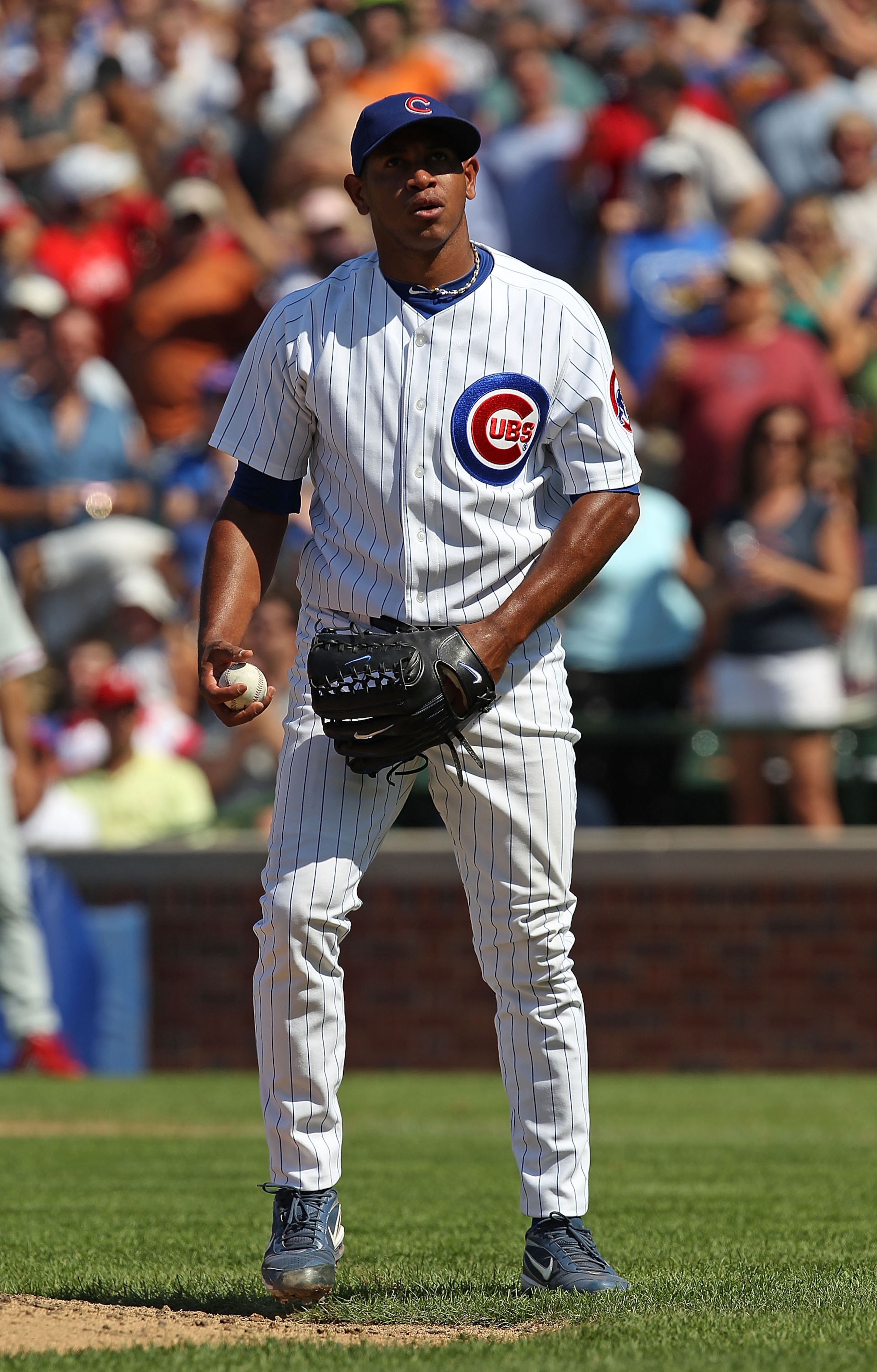 CHICAGO - JULY 16: Carlos Marmol #49 of the Chicago Cubs waits to pitch in the 9th inning against the Philadelphia Phillies at Wrigley Field on July 16, 2010 in Chicago, Illinois. The Cubs defeated the Phillies 4-3. (Photo by Jonathan Daniel/Getty Images) CHICAGO - JULY 16: Carlos Marmol #49 of the Chicago Cubs waits to pitch in the 9th inning against the Philadelphia Phillies at Wrigley Field on July 16, 2010 in Chicago, Illinois. The Cubs defeated the Phillies 4-3. (Photo by Jonathan Daniel/Getty Images)