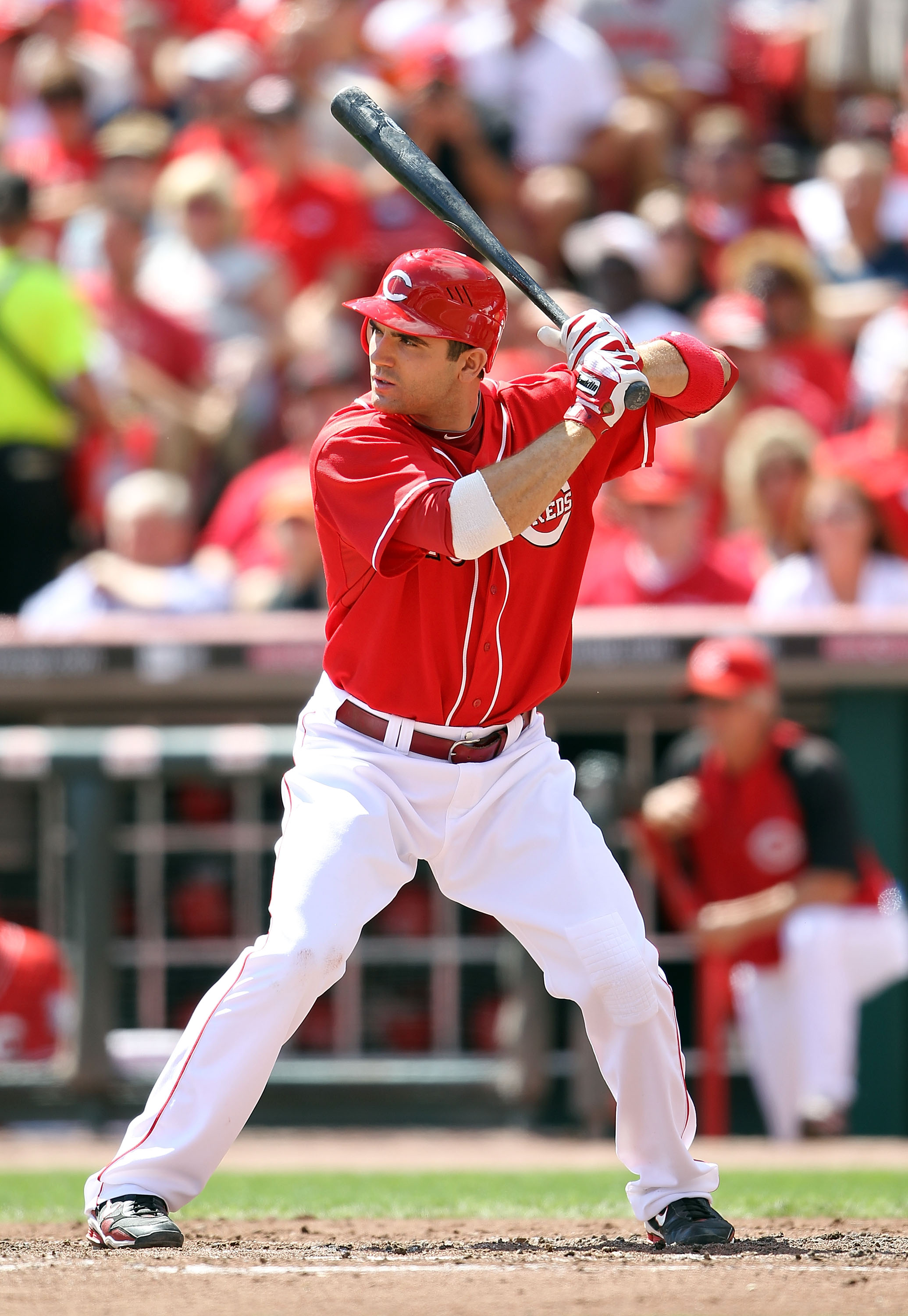 Joey votto Cincinnati Reds Unsigned Hitting in White Jersey Photograph