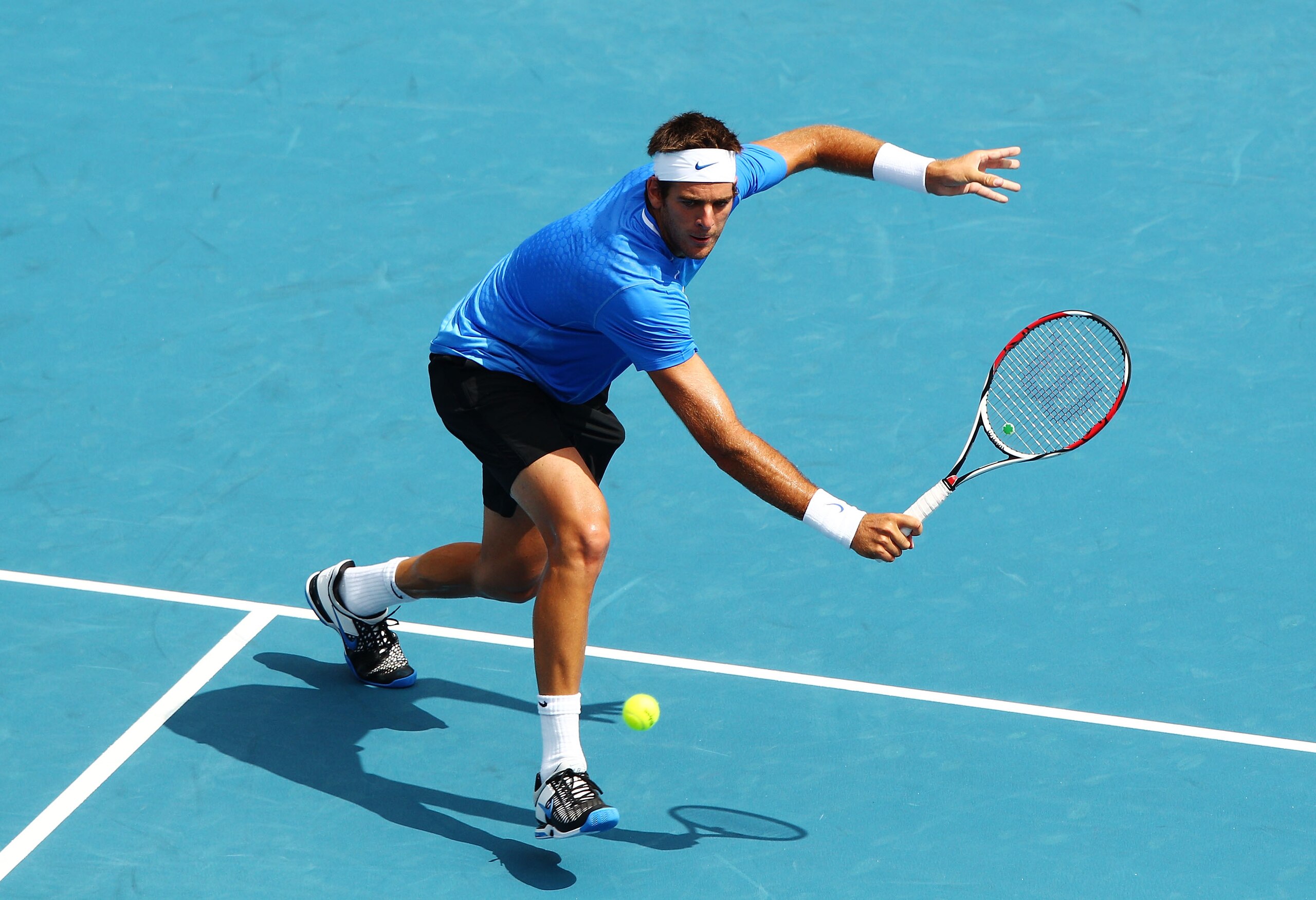 SYDNEY, AUSTRALIA - JANUARY 12: Juan Martin Del Potro of Argentina plays a backhand in his match against Florian Mayer of Germany during day four of the 2011 Medibank International at Sydney Olympic Park Tennis Centre on January 12, 2011 in Sydney, Austr SYDNEY, AUSTRALIA - JANUARY 12: Juan Martin Del Potro of Argentina plays a backhand in his match against Florian Mayer of Germany during day four of the 2011 Medibank International at Sydney Olympic Park Tennis Centre on January 12, 2011 in Sydney, Austr