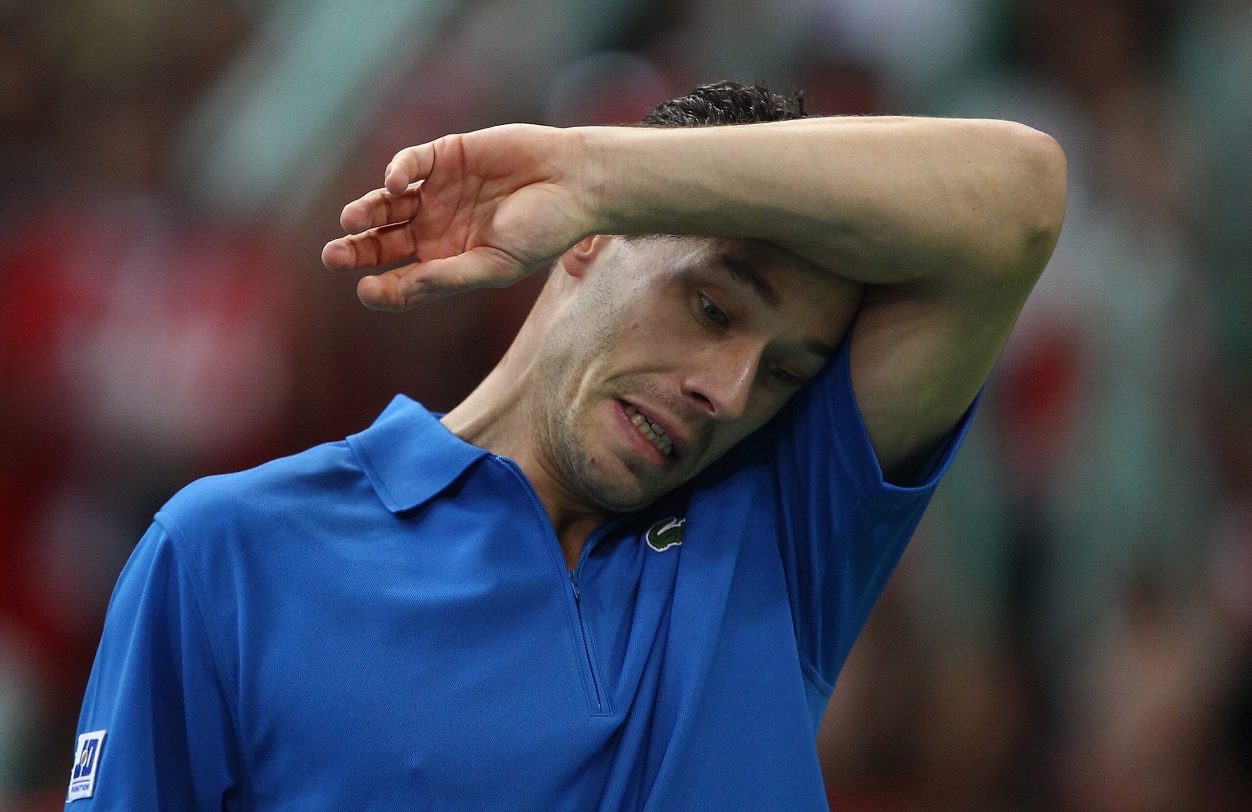 BELGRADE, SERBIA - DECEMBER 05: Michael Llodra of France struggles in his match against Viktor Troicki of Serbia during day three of the Davis Cup Tennis Final at the Begrade Arena on December 5, 2010 in Belgrade, Serbia. (Photo by Julian Finney/Getty I BELGRADE, SERBIA - DECEMBER 05: Michael Llodra of France struggles in his match against Viktor Troicki of Serbia during day three of the Davis Cup Tennis Final at the Begrade Arena on December 5, 2010 in Belgrade, Serbia. (Photo by Julian Finney/Getty I
