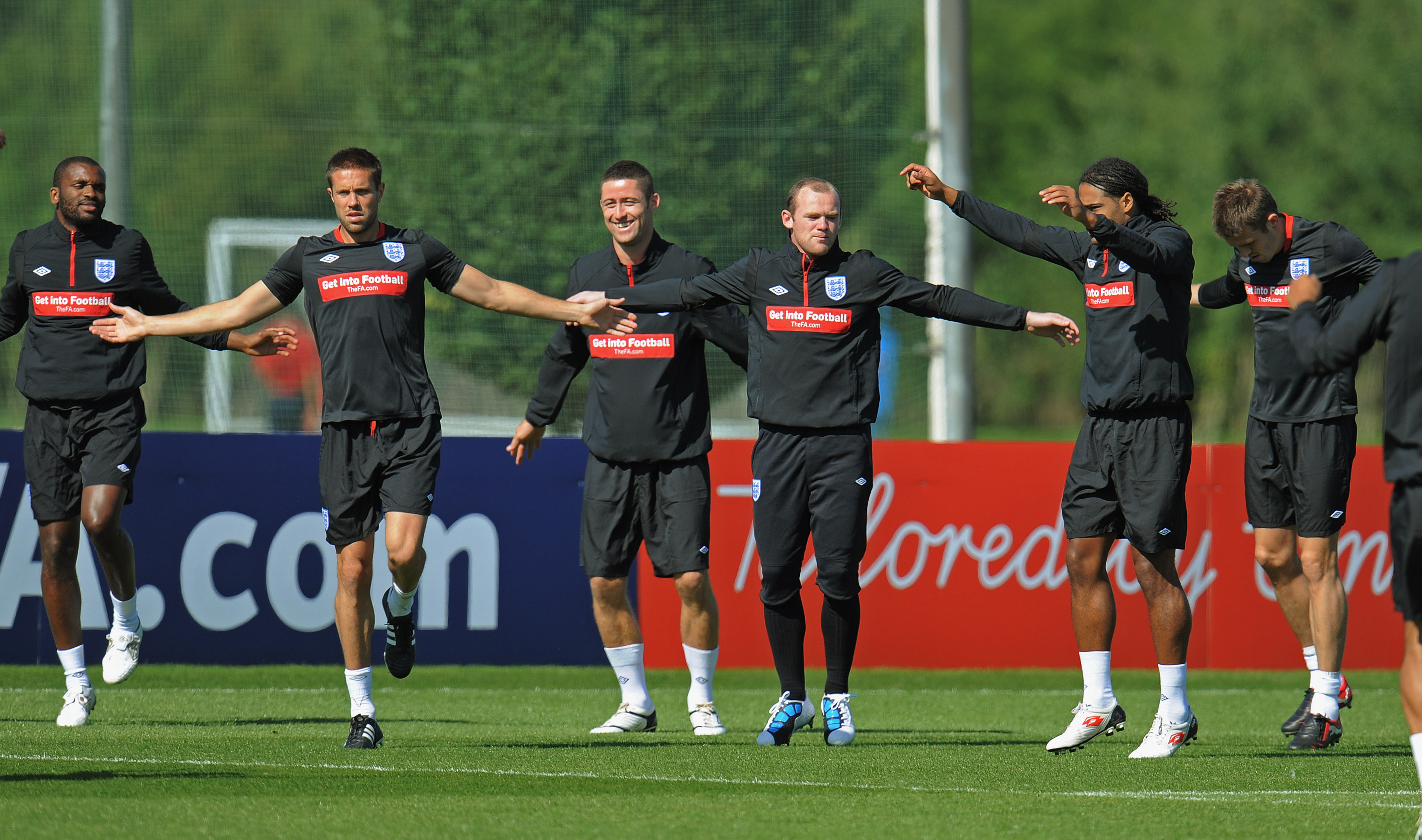 ST ALBANS, ENGLAND - AUGUST 31: Darren Bent, Matthew Upson, Gary Cahill and Wayne Rooney warm up during the England training session at London Colney on August 31, 2010 in St Albans, England.  (Photo by Michael Regan/Getty Images)