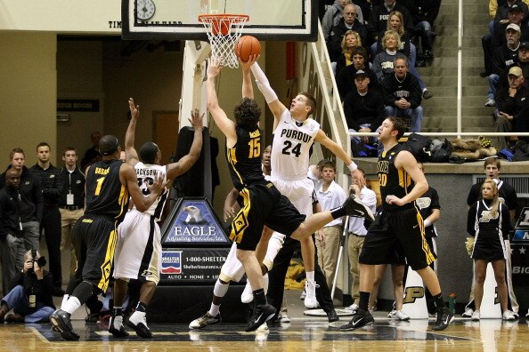 WEST LAFAYETTE, IN - JANUARY 09:  Ryne Smith #25 of the Purdue Boilermakers blocks a shot attempt by Zach McCabe #15 of the Iowa Hawkeyes at Mackey Arena on January 9, 2011 in West Lafayette, Indiana. Purdue won 75-52. (Photo by Chris Chambers/Getty Image