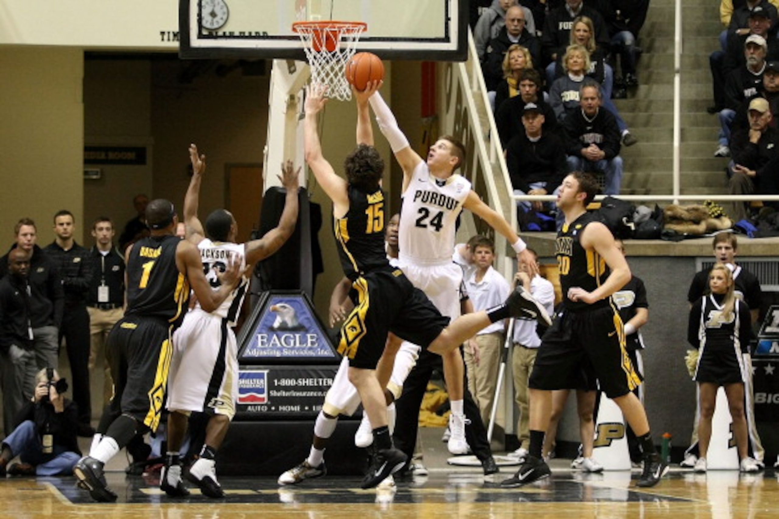 WEST LAFAYETTE, IN - JANUARY 09:  Ryne Smith #25 of the Purdue Boilermakers blocks a shot attempt by Zach McCabe #15 of the Iowa Hawkeyes at Mackey Arena on January 9, 2011 in West Lafayette, Indiana. Purdue won 75-52. (Photo by Chris Chambers/Getty Image