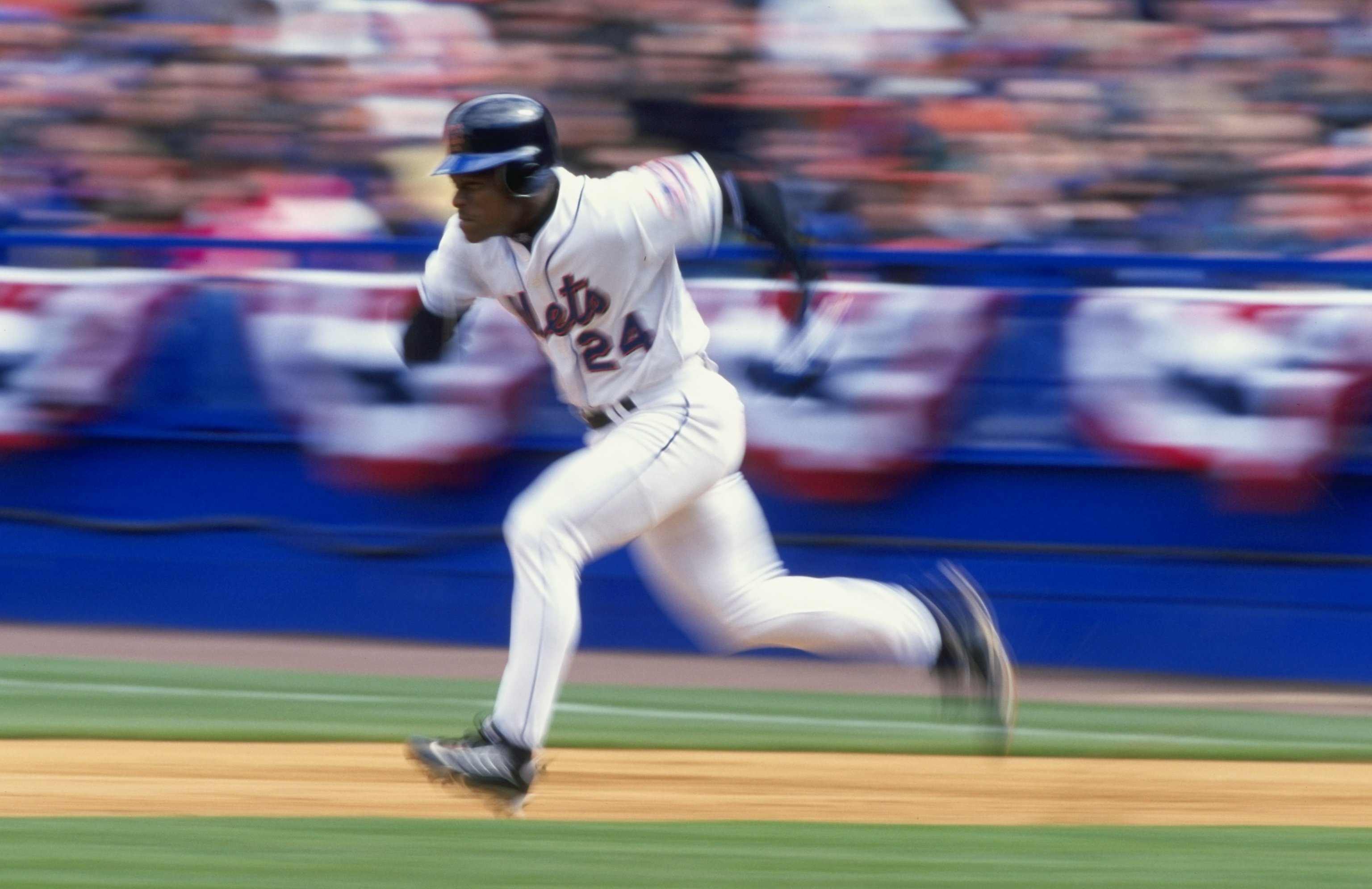 12 Apr 1999:  Outfielder Rickey Henderson #24 of the New York Mets attempts a steal of second base during the game against the Florida Marlins at Shea Stadium in Flushing Meadow, New York. The Mets defeated the Marlins 8-1. Mandatory Credit: Ezra O. Shaw/