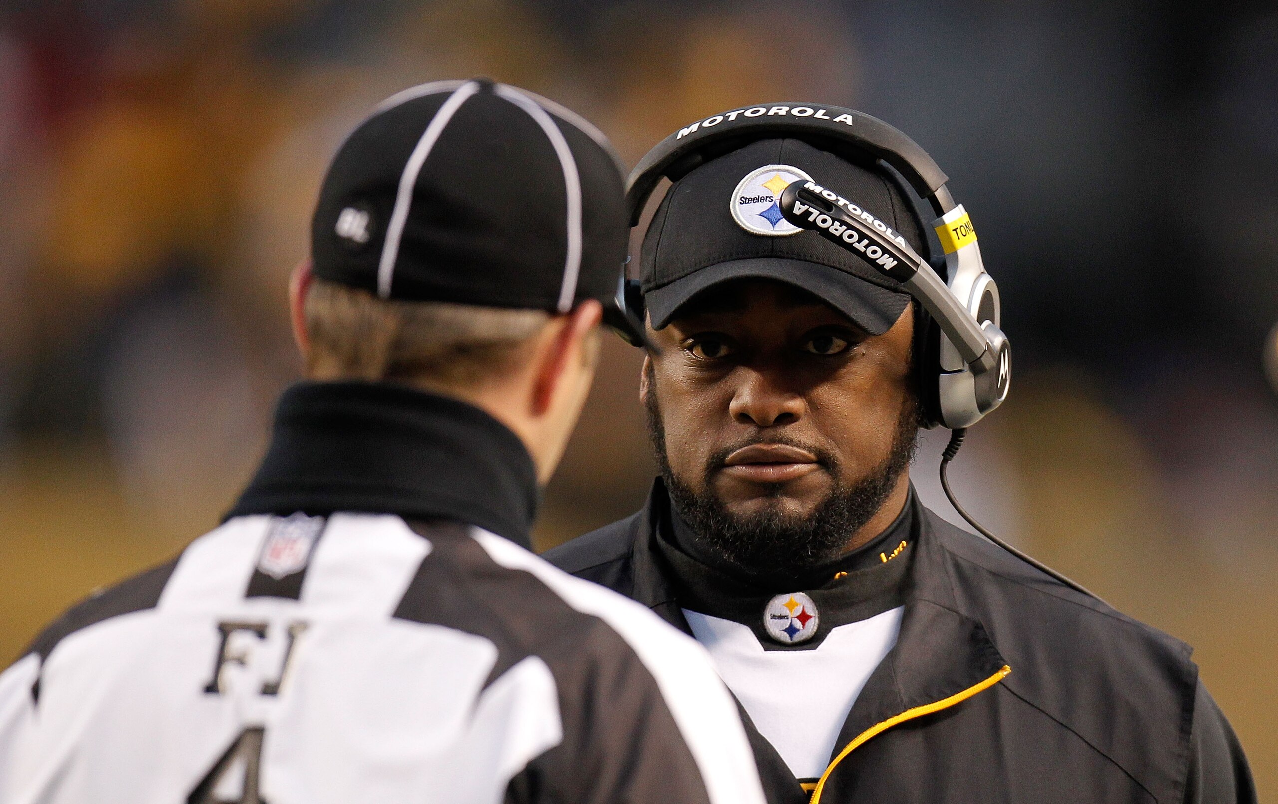 PITTSBURGH, PA - JANUARY 15:  Head coach Mike Tomlin of the Pittsburgh Steelers speaks with a referee during the AFC Divisional Playoff Game against the Baltimore Ravens at Heinz Field on January 15, 2011 in Pittsburgh, Pennsylvania.  (Photo by Gregory Sh