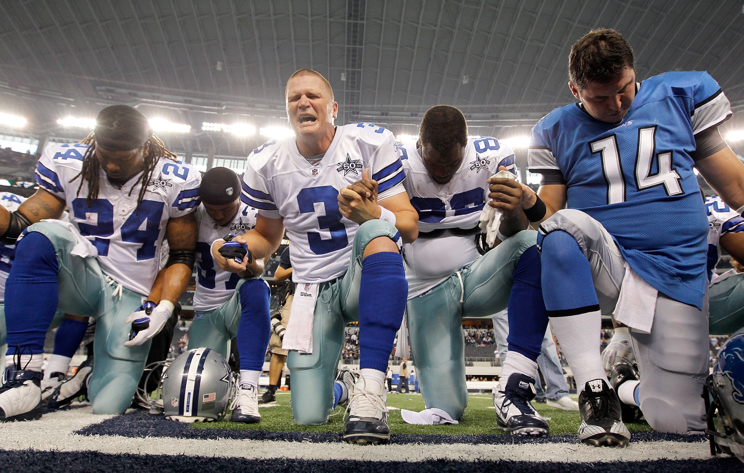 ARLINGTON, TX - NOVEMBER 21:  Quarterback Jon Kitna (C) #3 of the Dallas Cowboys leads a team prayer with running back Marion Barber #24, cornerback Bryan McCain #37, wide receiver Dez Bryant #88, and quarterback Shaun Hill #14 of the Detroit Lions at Cow