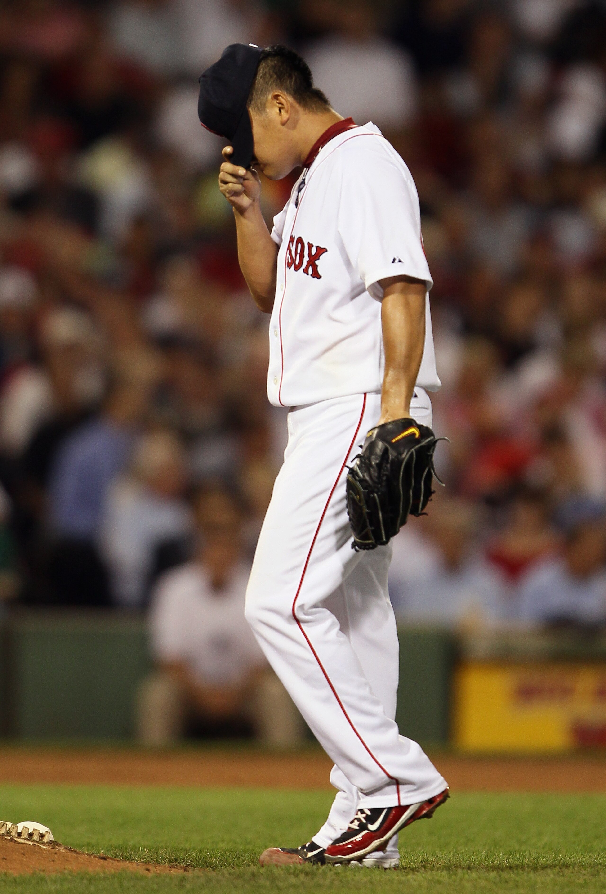 BOSTON - SEPTEMBER 07: Daisuke Matsuzaka #18 of the Boston Red Sox adjusts his hat after giving up four runs in the fourth inning against the Tampa Bay Rays on September 7, 2010 at Fenway Park in Boston, Massachusetts. (Photo by Elsa/Getty Images) BOSTON - SEPTEMBER 07: Daisuke Matsuzaka #18 of the Boston Red Sox adjusts his hat after giving up four runs in the fourth inning against the Tampa Bay Rays on September 7, 2010 at Fenway Park in Boston, Massachusetts. (Photo by Elsa/Getty Images)