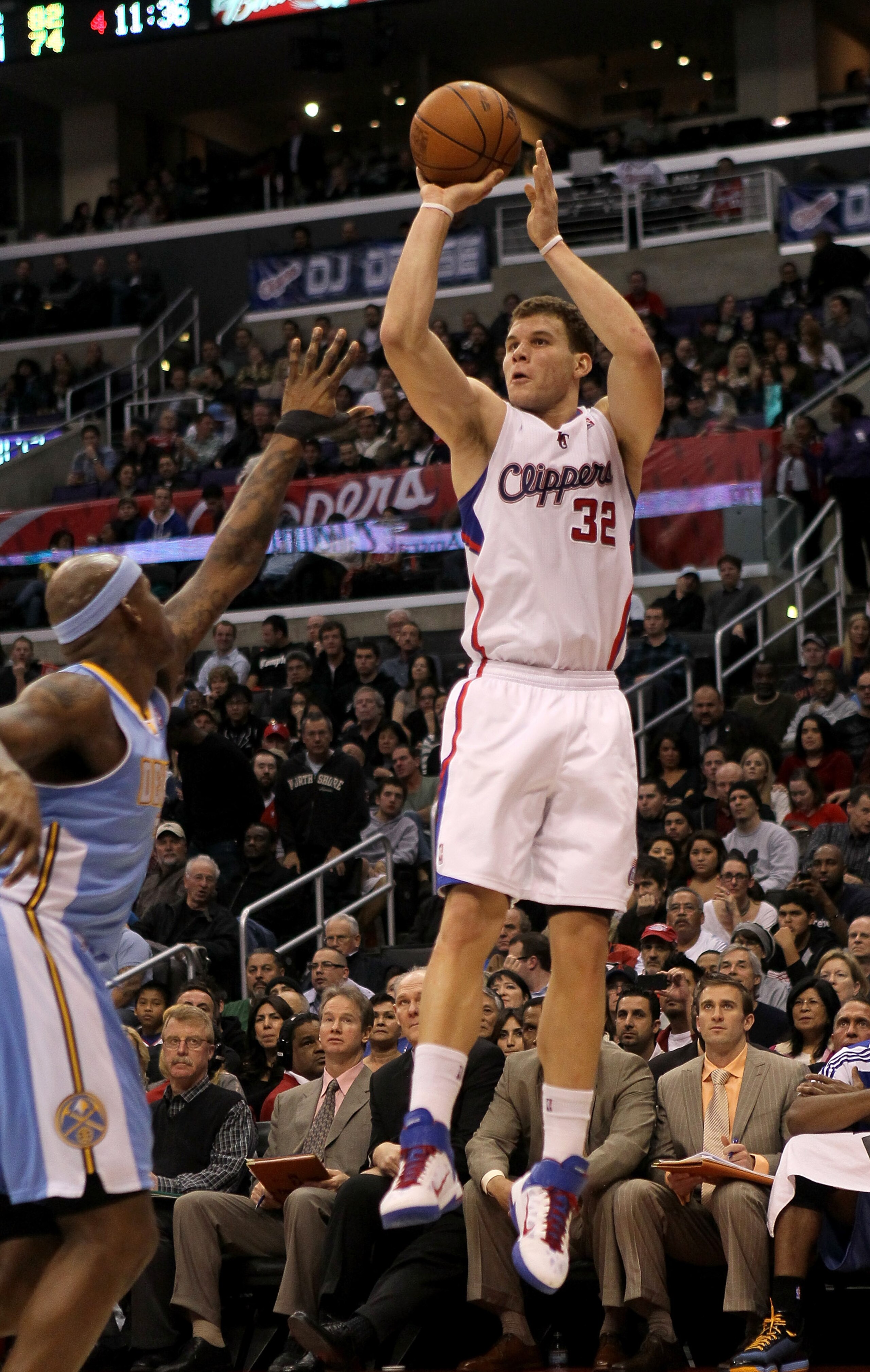 LOS ANGELES, CA - JANUARY 05:  Blake Griffin #32 of the Los Angeles Clippers takes a jump shot over Al Harrington #7 of the Denver Nuggets at Staples Center on January 5, 2011  in Los Angeles, California. The Clippers won 106-93.  NOTE TO USER: User expre