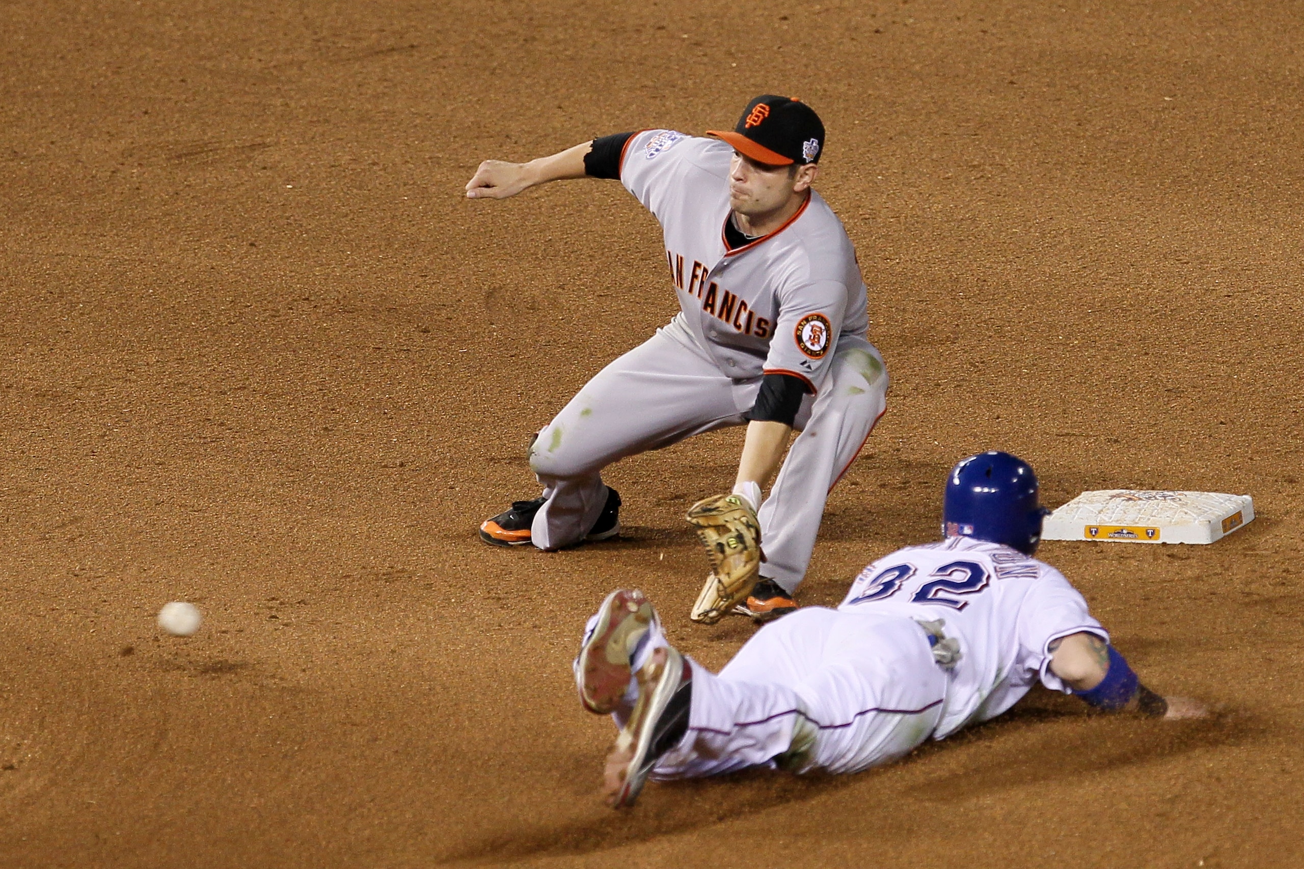 ARLINGTON, TX - OCTOBER 31:  Josh Hamilton #32 of the Texas Rangers steals second under the tag from Freddy Sanchez #21 of the San Francisco Giants in Game Four of the 2010 MLB World Series at Rangers Ballpark in Arlington on October 31, 2010 in Arlington