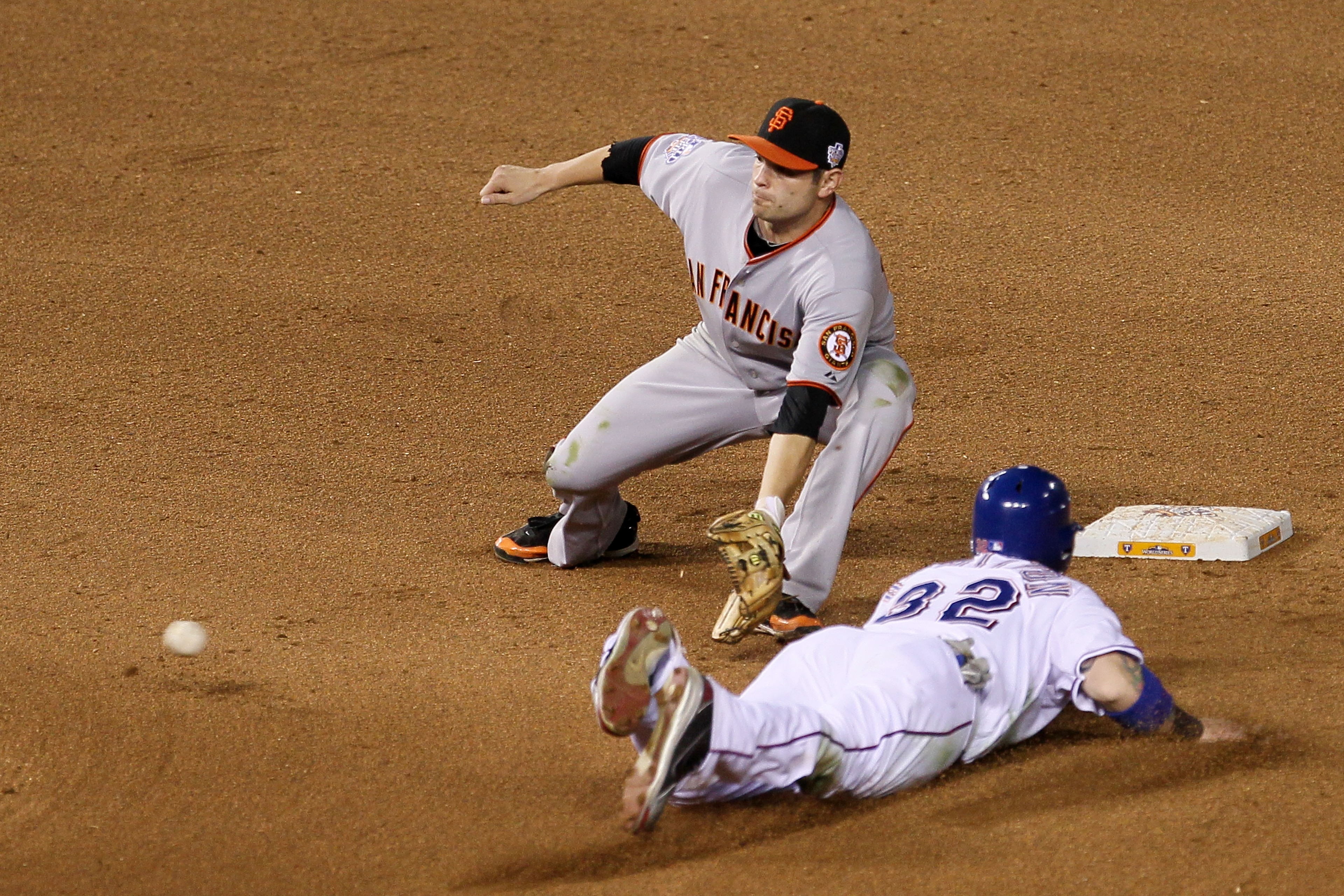 ARLINGTON, TX - OCTOBER 31:  Josh Hamilton #32 of the Texas Rangers steals second under the tag from Freddy Sanchez #21 of the San Francisco Giants in Game Four of the 2010 MLB World Series at Rangers Ballpark in Arlington on October 31, 2010 in Arlington