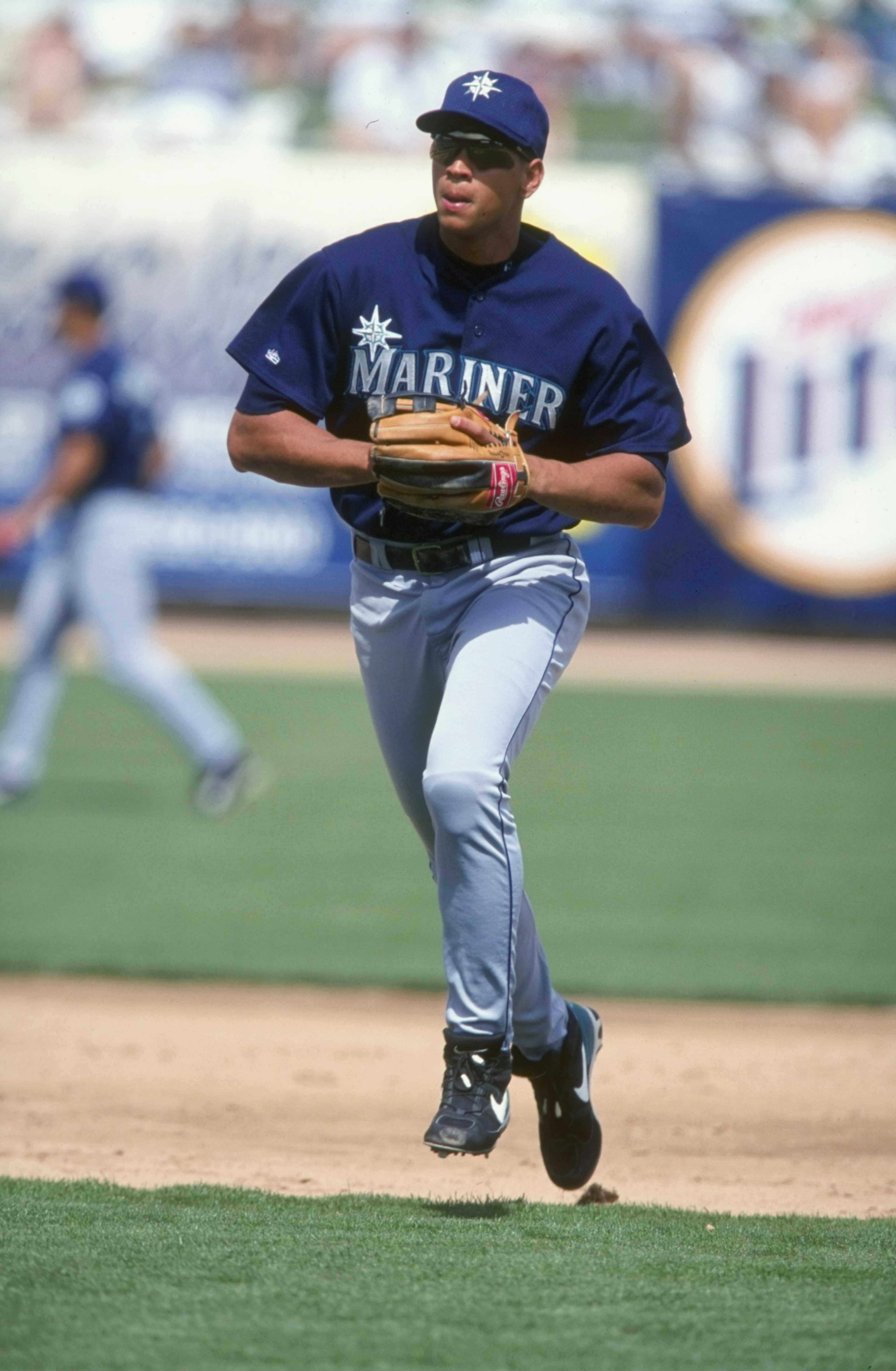 14 Mar 1999:  Infielder Alex Rodriguez #3 of the Seattle Mariners runs off the field during the Spring Training game against the Chicago Cubs at the HoHoKam Park in Mesa, Arizona. The Mariners defeated the Cubs 8-7. Mandatory Credit: Tom Hauck  /Allsport