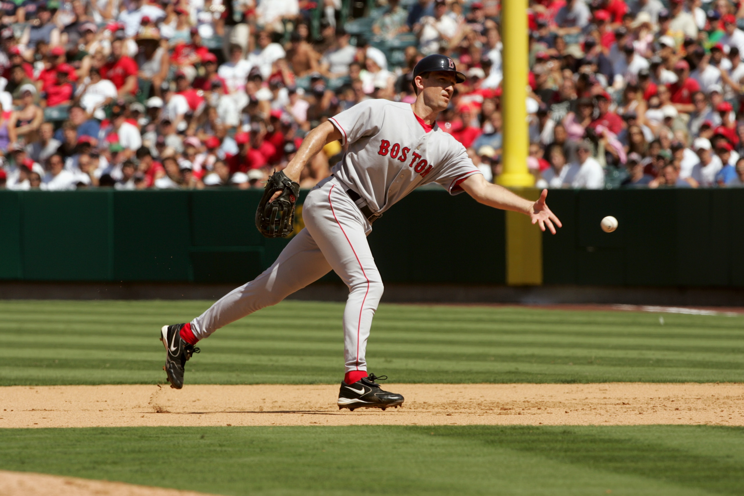 ANAHEIM, CA - AUGUST 21:  Infielder John Olerud #19 of the Boston Red Sox tosses the ball during the game against the Los Angeles Angels of Anaheim on August 21, 2005 at Angel Stadium in Anaheim, California.  The Red Sox won 5-1.   (Photo by Stephen Dunn/