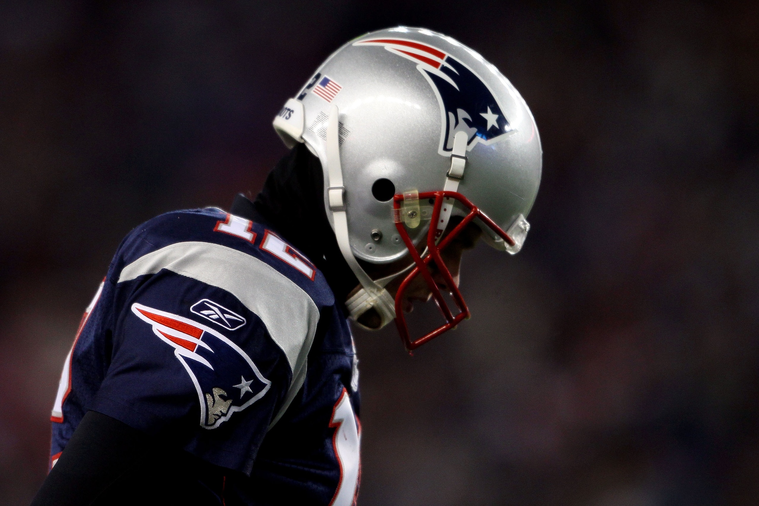 FOXBORO, MA - JANUARY 16:  Tom Brady #12 of the New England Patriots walks off the field during their 2011 AFC divisional playoff game against the New York Jets at Gillette Stadium on January 16, 2011 in Foxboro, Massachusetts.  (Photo by Elsa/Getty Image