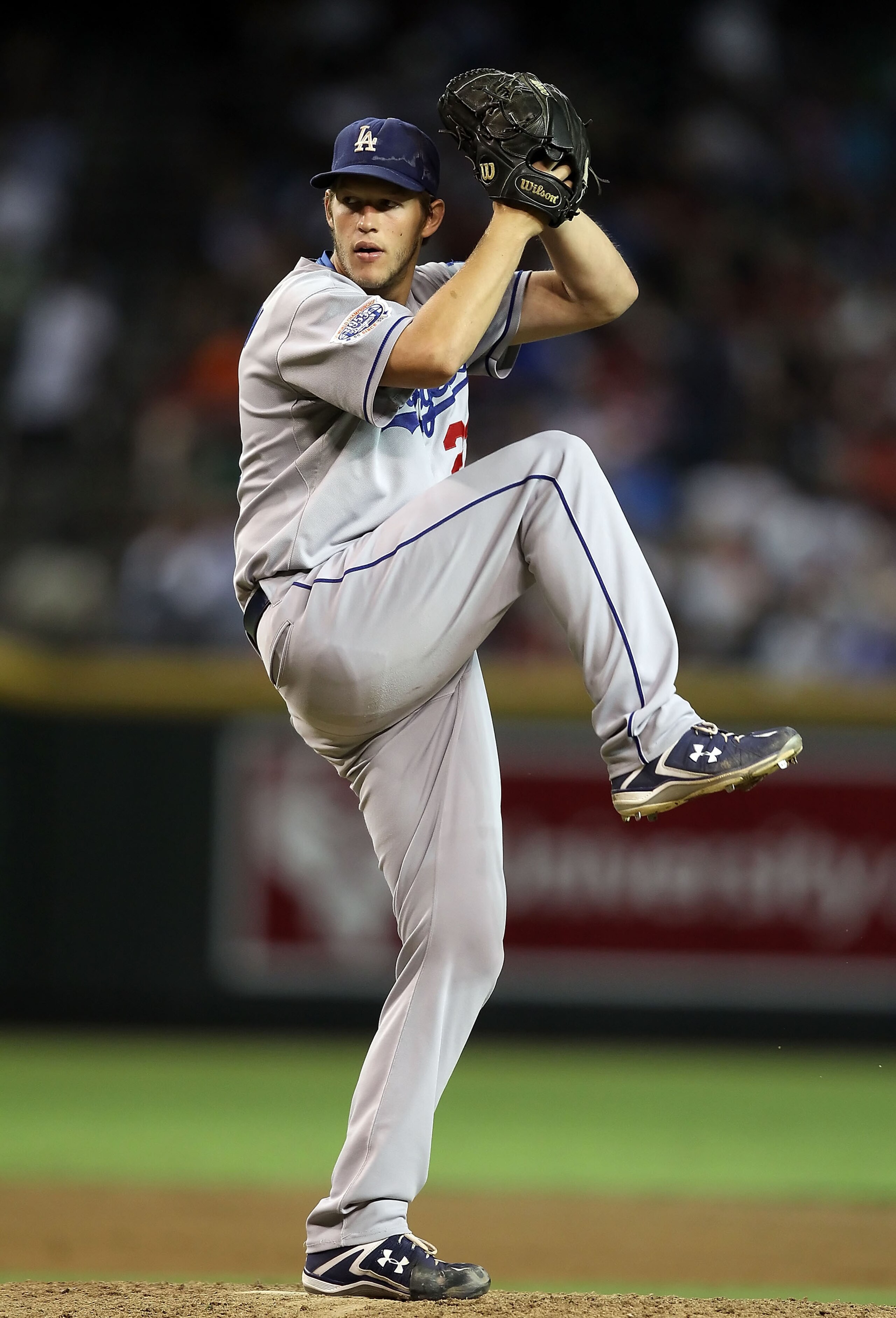 PHOENIX - SEPTEMBER 24:  Starting pitcher Clayton Kershaw #22 of the Los Angeles Dodgers pitches against the Arizona Diamondbacks during the Major League Baseball game at Chase Field on September 24, 2010 in Phoenix, Arizona.  (Photo by Christian Petersen