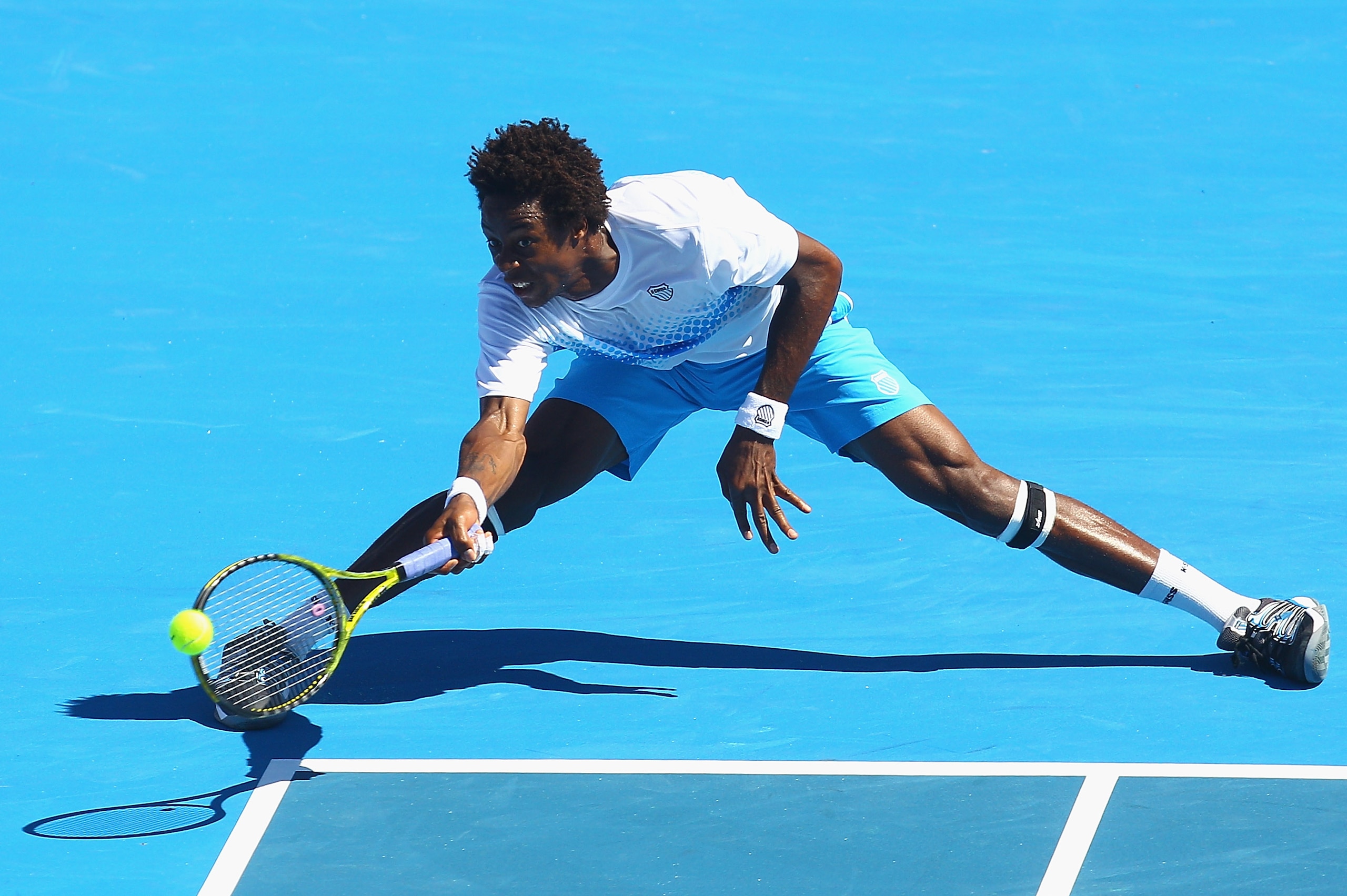 MELBOURNE, AUSTRALIA - JANUARY 15: Gael Monfils of France stretches to play a forehand during his match against Lleyton Hewitt of Australia during day four of the AAMI Classic at Kooyong on January 15, 2011 in Melbourne, Australia. (Photo by Quinn Roone MELBOURNE, AUSTRALIA - JANUARY 15: Gael Monfils of France stretches to play a forehand during his match against Lleyton Hewitt of Australia during day four of the AAMI Classic at Kooyong on January 15, 2011 in Melbourne, Australia. (Photo by Quinn Roone