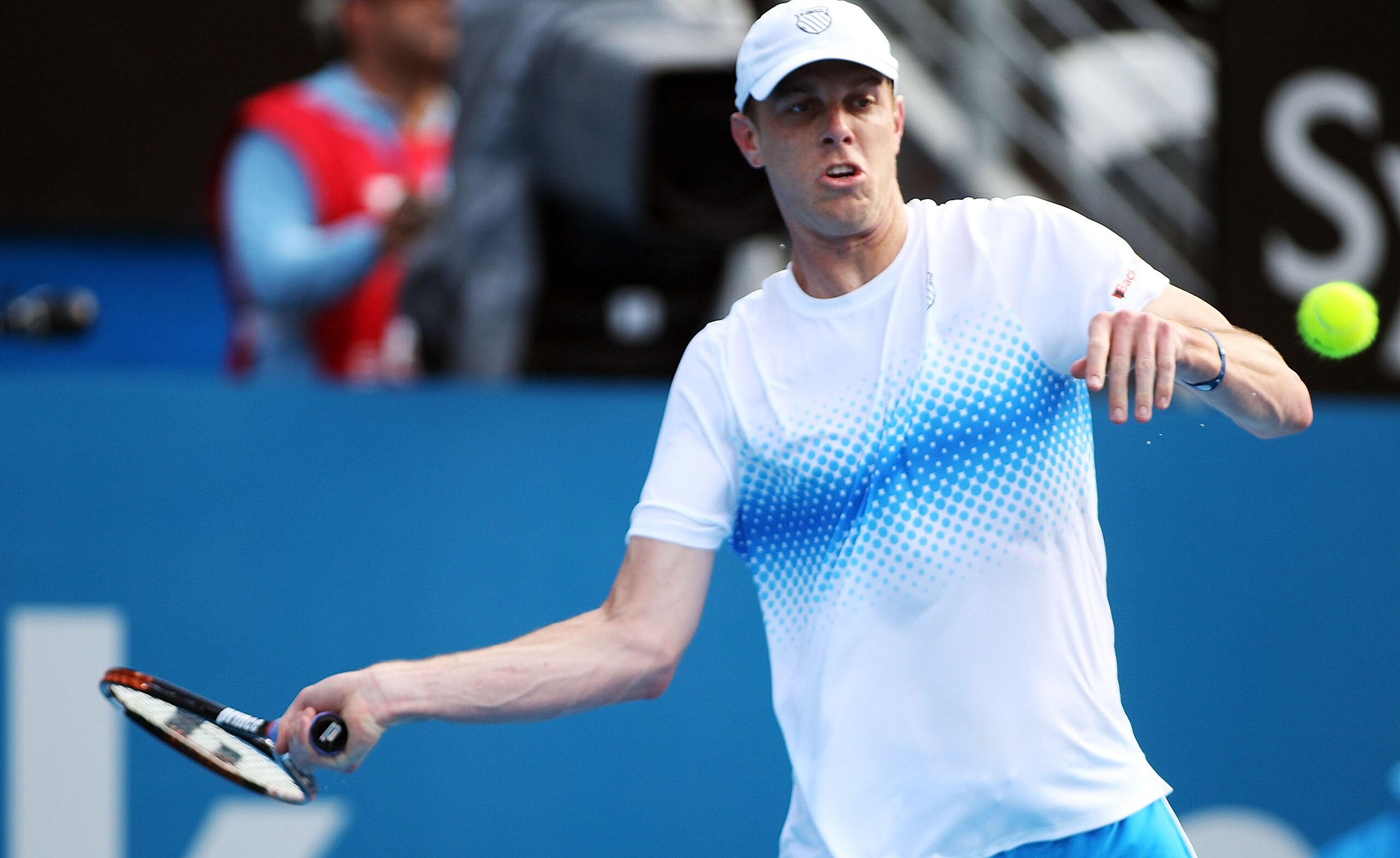 SYDNEY, AUSTRALIA - JANUARY 12: Sam Querrey of the USA plays a forehand in his match against Alexandr Dolgopolov of Ukraine during day four of the 2011 Medibank International at Sydney Olympic Park Tennis Centre on January 12, 2011 in Sydney, Australia. SYDNEY, AUSTRALIA - JANUARY 12: Sam Querrey of the USA plays a forehand in his match against Alexandr Dolgopolov of Ukraine during day four of the 2011 Medibank International at Sydney Olympic Park Tennis Centre on January 12, 2011 in Sydney, Australia.
