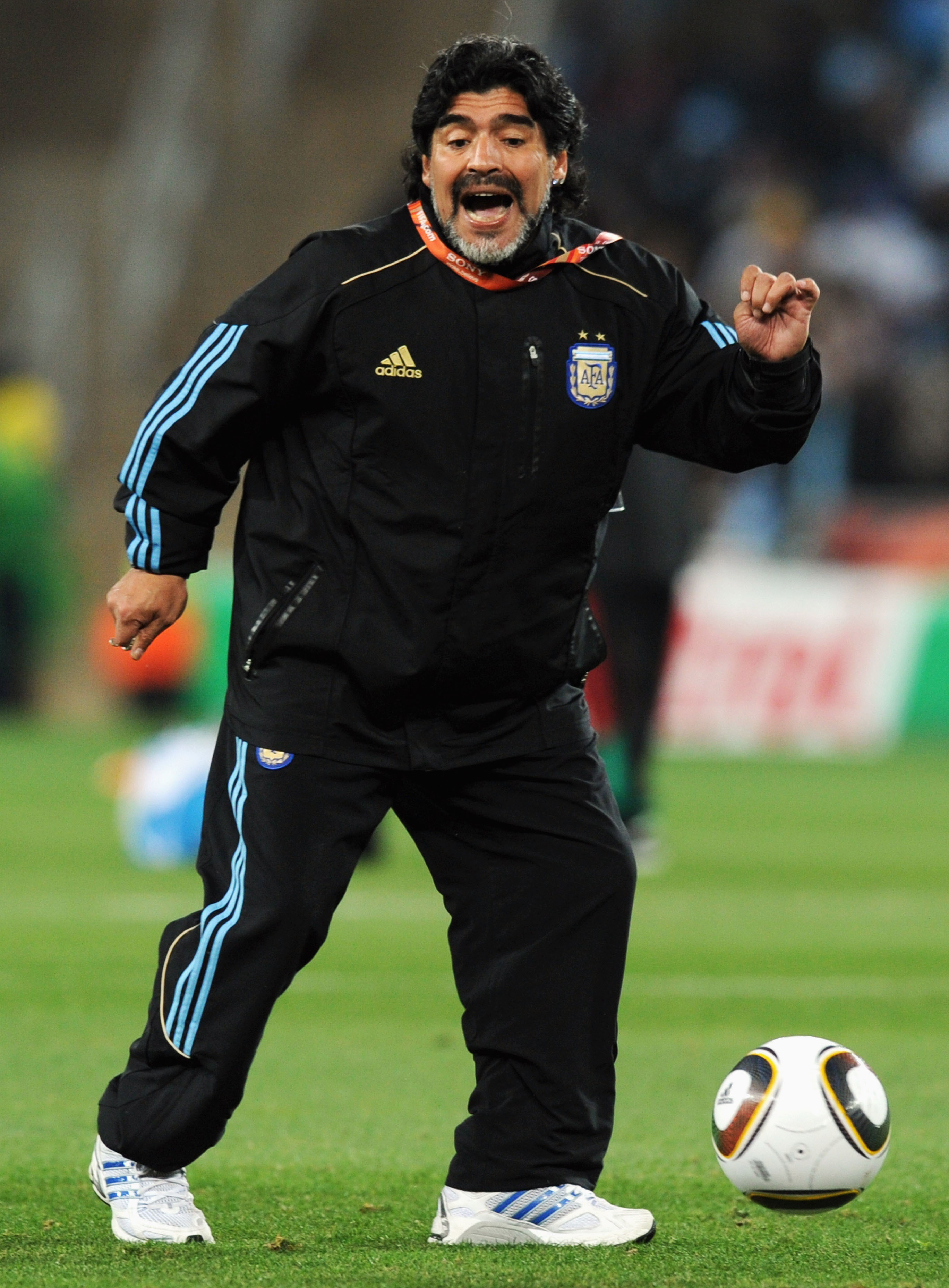 JOHANNESBURG, SOUTH AFRICA - JUNE 27:  Diego Maradona head coach of Argentina controls the ball during the warm up ahead of the 2010 FIFA World Cup South Africa Round of Sixteen match between Argentina and Mexico at Soccer City Stadium on June 27, 2010 in