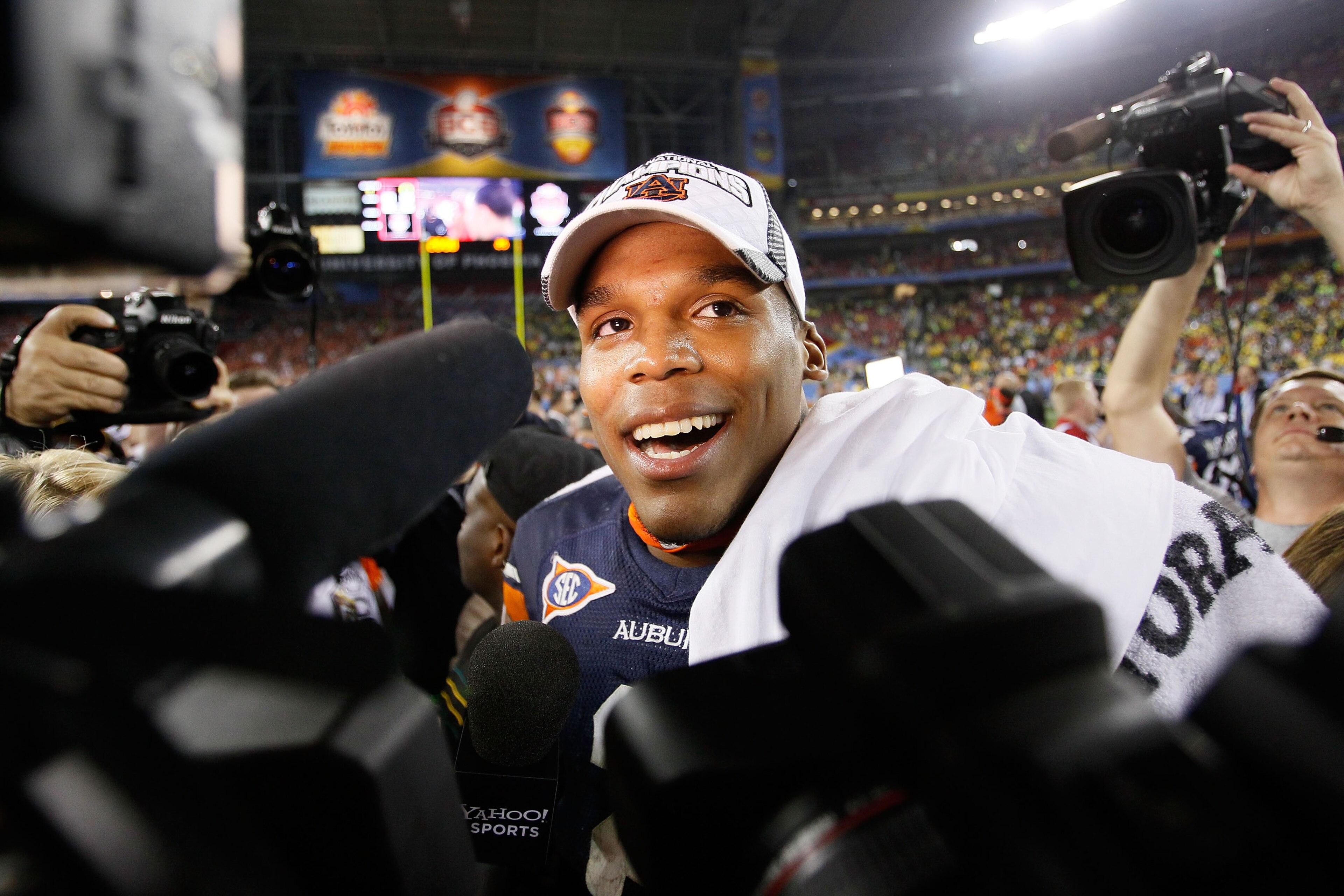 GLENDALE, AZ - JANUARY 10: Quarterback Cameron Newton #2 of the Auburn Tigers celebrates the Tigers 22-19 victory against the Oregon Ducks in the Tostitos BCS National Championship Game at University of Phoenix Stadium on January 10, 2011 in Glendale, Ar GLENDALE, AZ - JANUARY 10: Quarterback Cameron Newton #2 of the Auburn Tigers celebrates the Tigers 22-19 victory against the Oregon Ducks in the Tostitos BCS National Championship Game at University of Phoenix Stadium on January 10, 2011 in Glendale, Ar