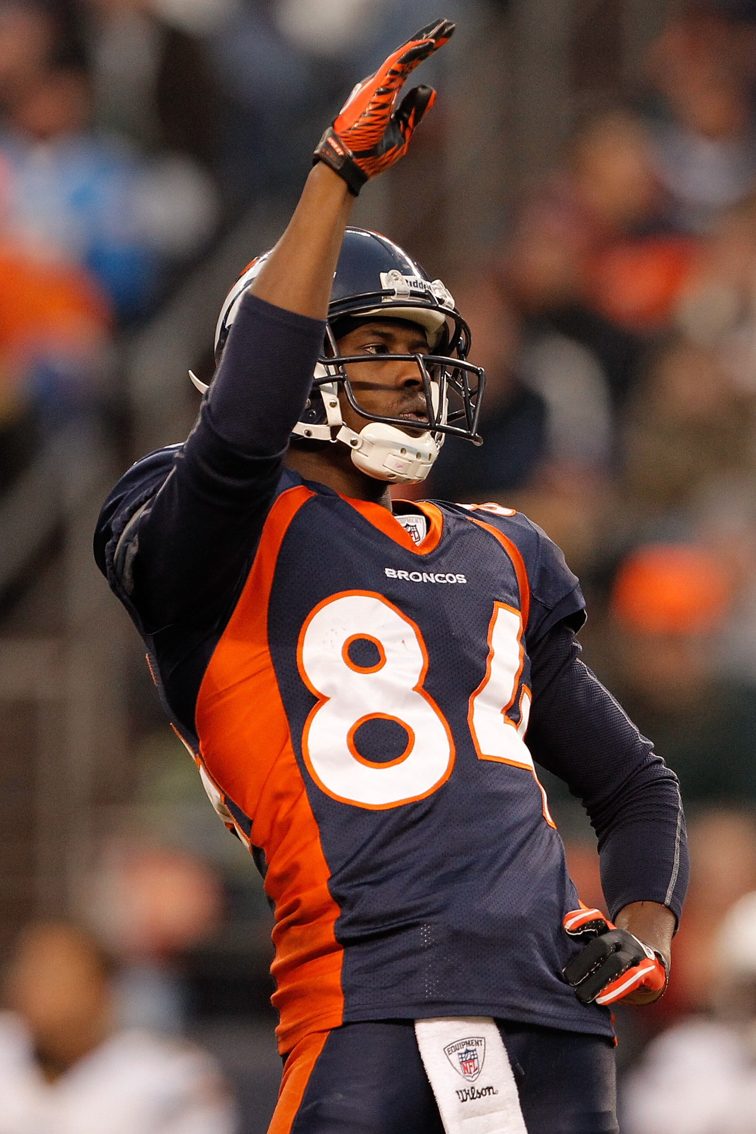 DENVER, CO - JANUARY 2:  Wide receiver Brandon Lloyd #84 of the Denver Broncos acknowledges the crowd  after an announcement to honor him for making the Pro Bowl team during a break in the action against the San Diego Chargers at INVESCO Field at Mile Hig