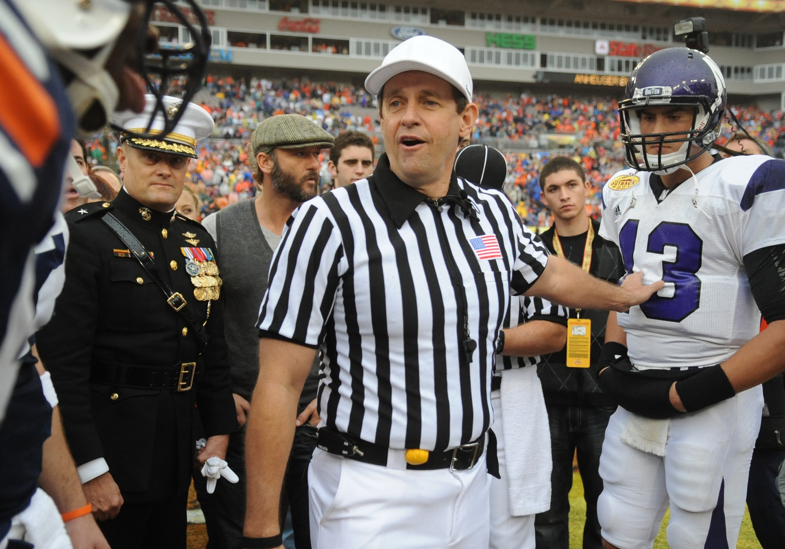 TAMPA, FL - JANUARY 1: NCAA referee Greg Burks sets for the coin toss before the Northwestern Wildcats play against the Auburn Tigers in the Outback Bowl January 1, 2010 at Raymond James Stadium in Tampa, Florida.  (Photo by Al Messerschmidt/Getty Images)