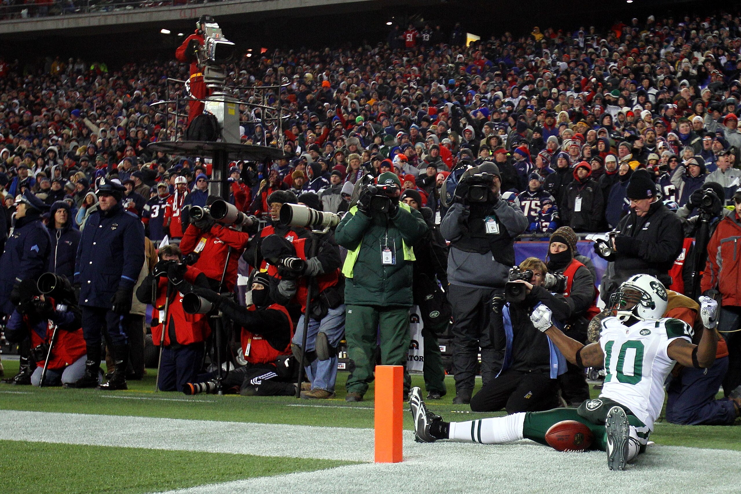 FOXBORO, MA - JANUARY 16:  Santonio Holmes #10 of the New York Jets celebrates his fourth quarter touchdown against the New England Patriots during their 2011 AFC divisional playoff game at Gillette Stadium on January 16, 2011 in Foxboro, Massachusetts.
