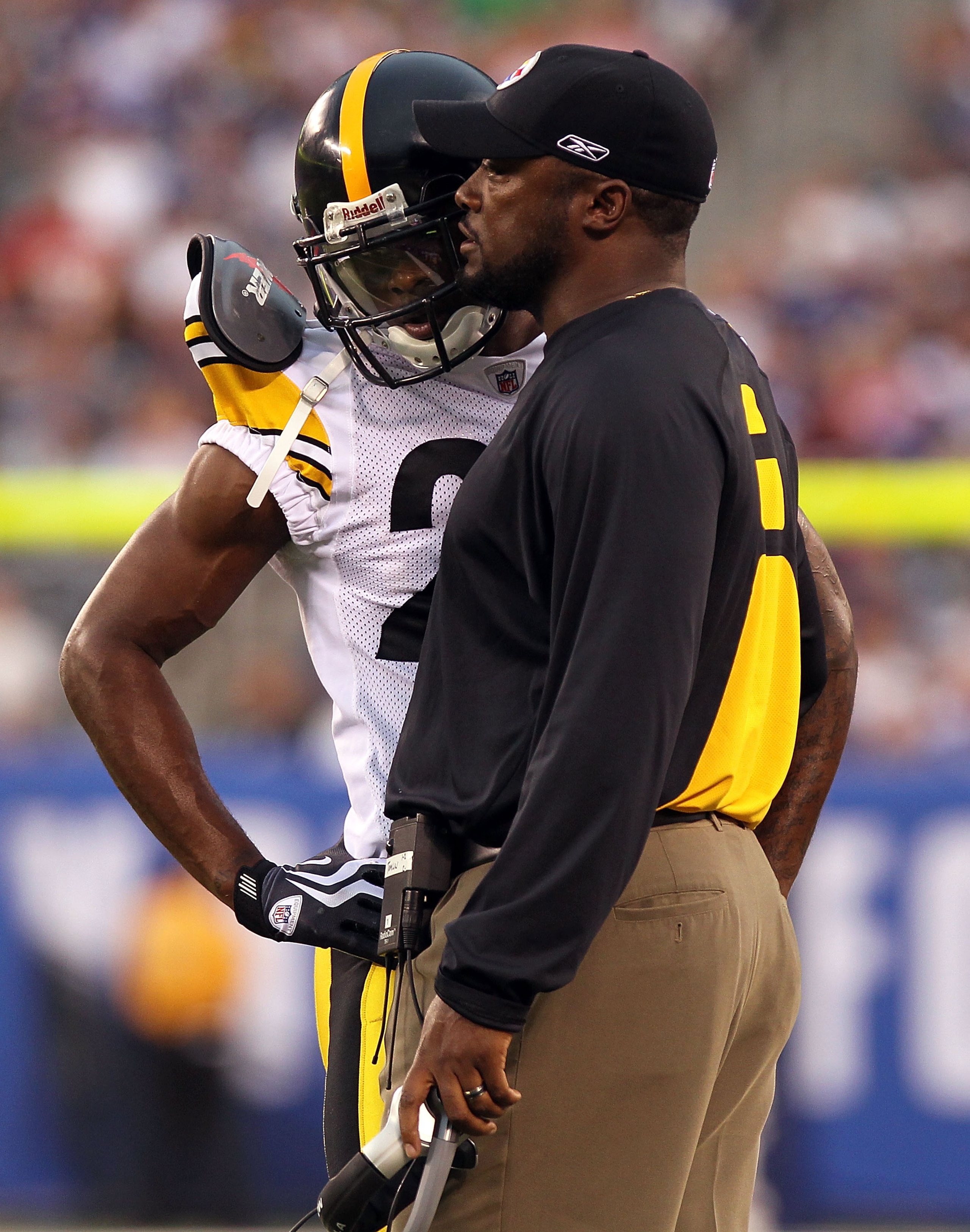 EAST RUTHERFORD, NJ - AUGUST 21:  Ike Taylor #24 of the Pittsburgh Steelers talks with head coach Mike Tomlin after being ejected from the game for fighting against the New York Giants during their preseason game at New Meadowlands Stadium on August 21, 2