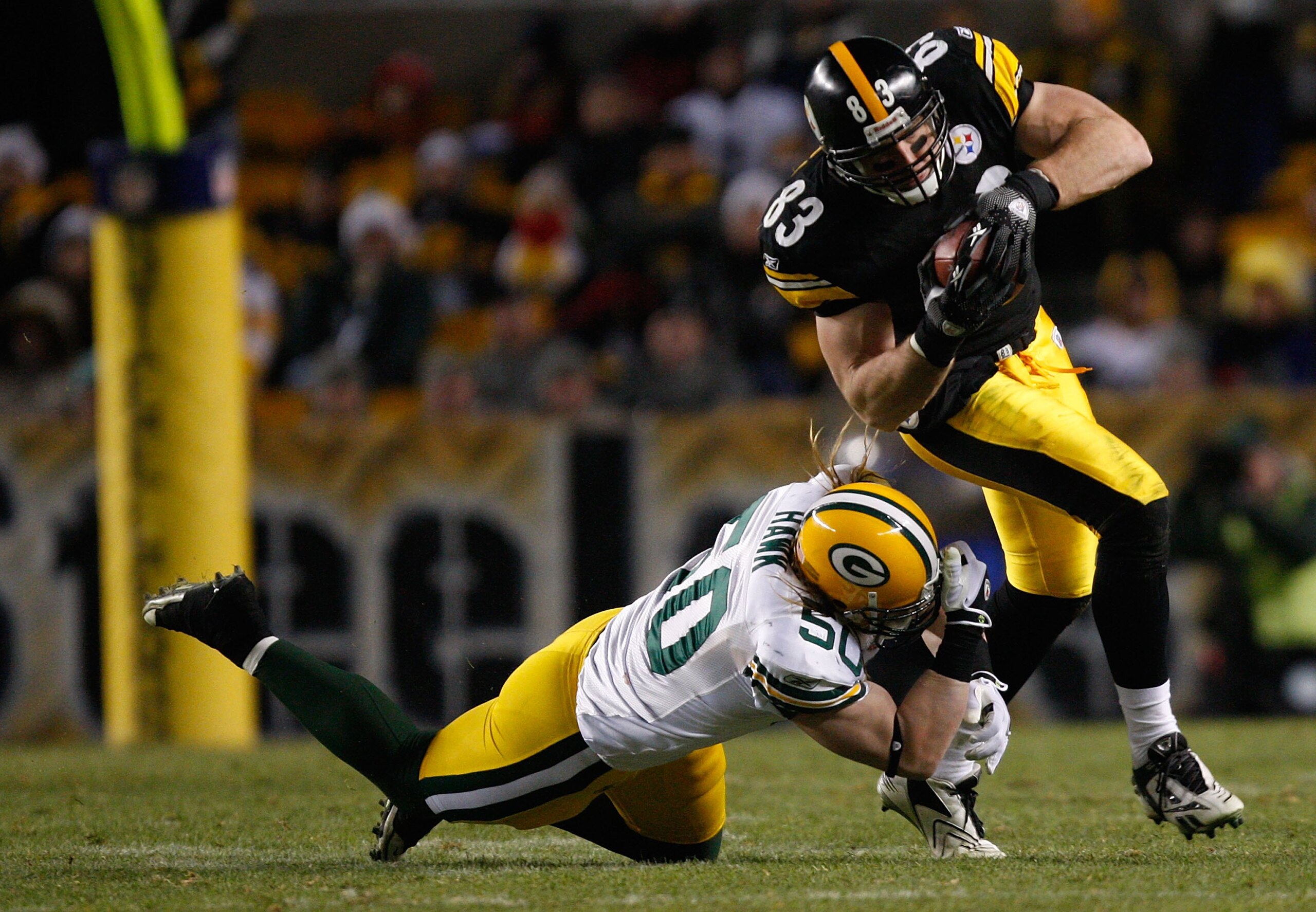 PITTSBURGH - DECEMBER 20: Heath Miller #83 of the Pittsburgh Steelers attempts to break through a tackle by AJ Hawk #50 of the Green Bay Packers during the game on December 20, 2009 at Heinz Field in Pittsburgh, Pennsylvania. (Photo by Jared Wickerham/Get PITTSBURGH - DECEMBER 20: Heath Miller #83 of the Pittsburgh Steelers attempts to break through a tackle by AJ Hawk #50 of the Green Bay Packers during the game on December 20, 2009 at Heinz Field in Pittsburgh, Pennsylvania. (Photo by Jared Wickerham/Get