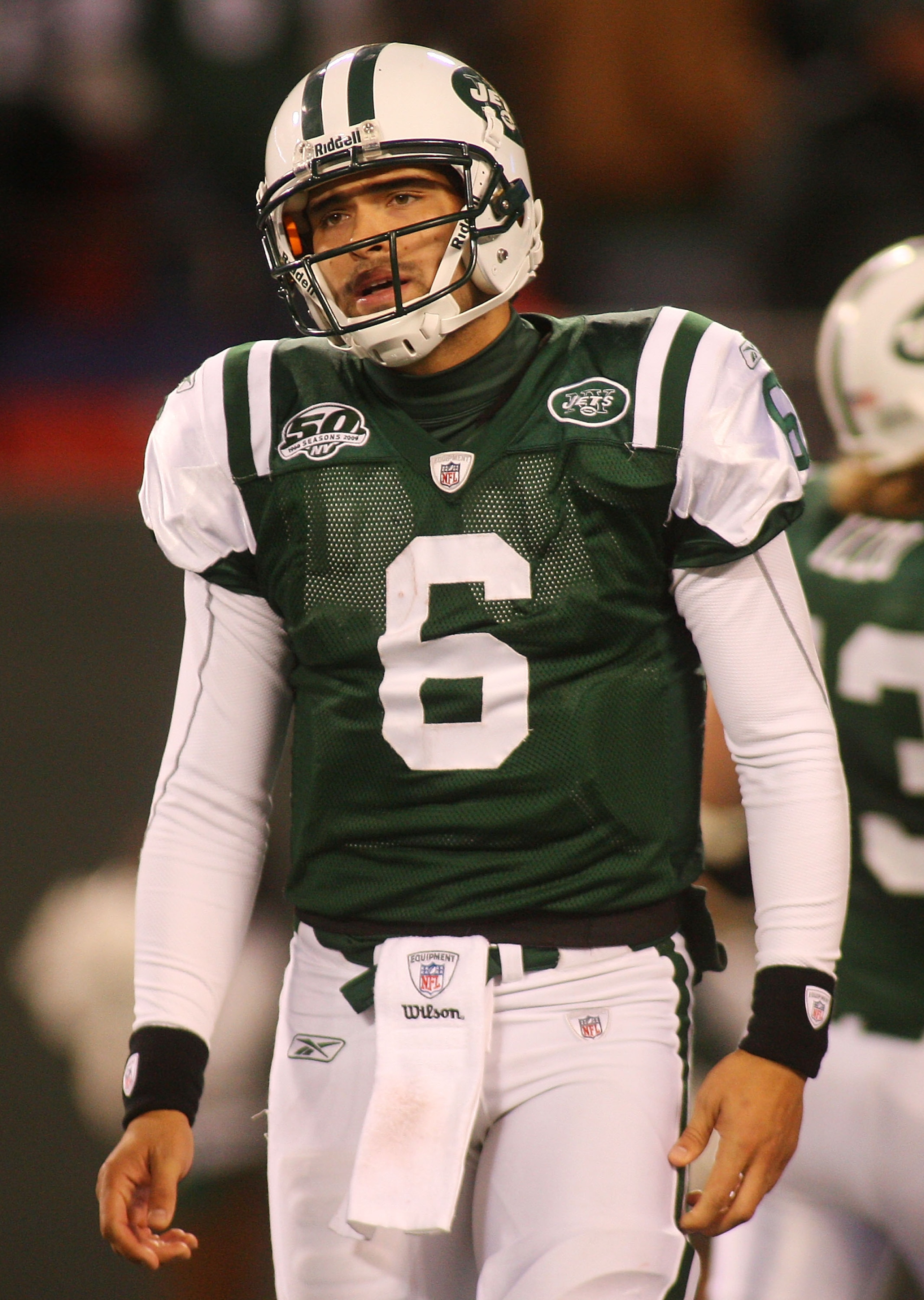 EAST RUTHERFORD, NJ - OCTOBER 18:  Ouarterback Mark Sanchez #6 of the New York Jets walks off the field dejected after failing to convert on third down in overtime against the Buffalo Bills at Giants Stadium in the Meadowlands on October 18, 2009 in East