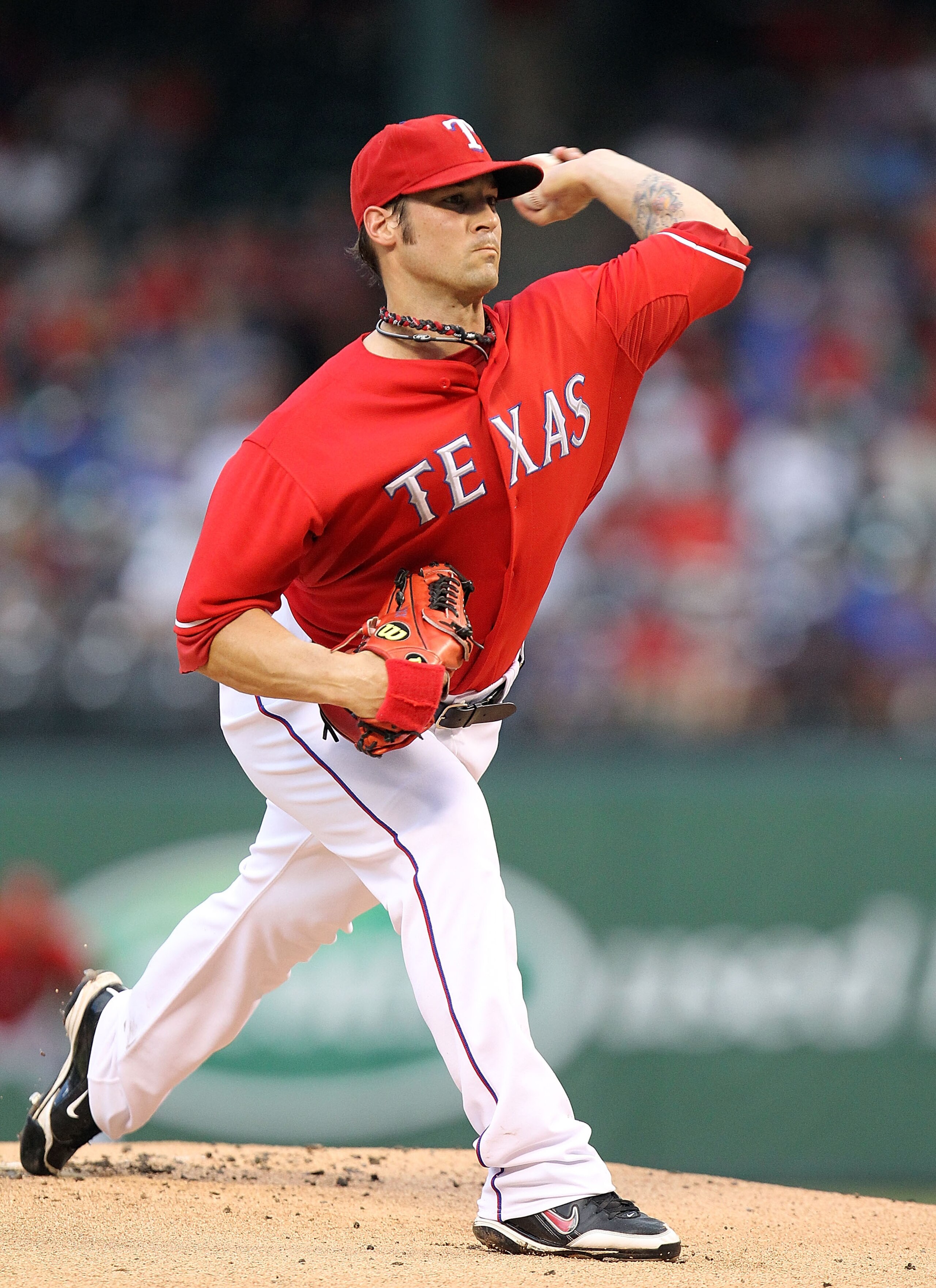ARLINGTON, TX - JULY 23:  C.J. Wilson #36 of the Texas Rangers throws against the Los Angeles Angels of Anaheim on July 23, 2010 at Rangers Ballpark in Arlington, Texas.  (Photo by Ronald Martinez/Getty Images)