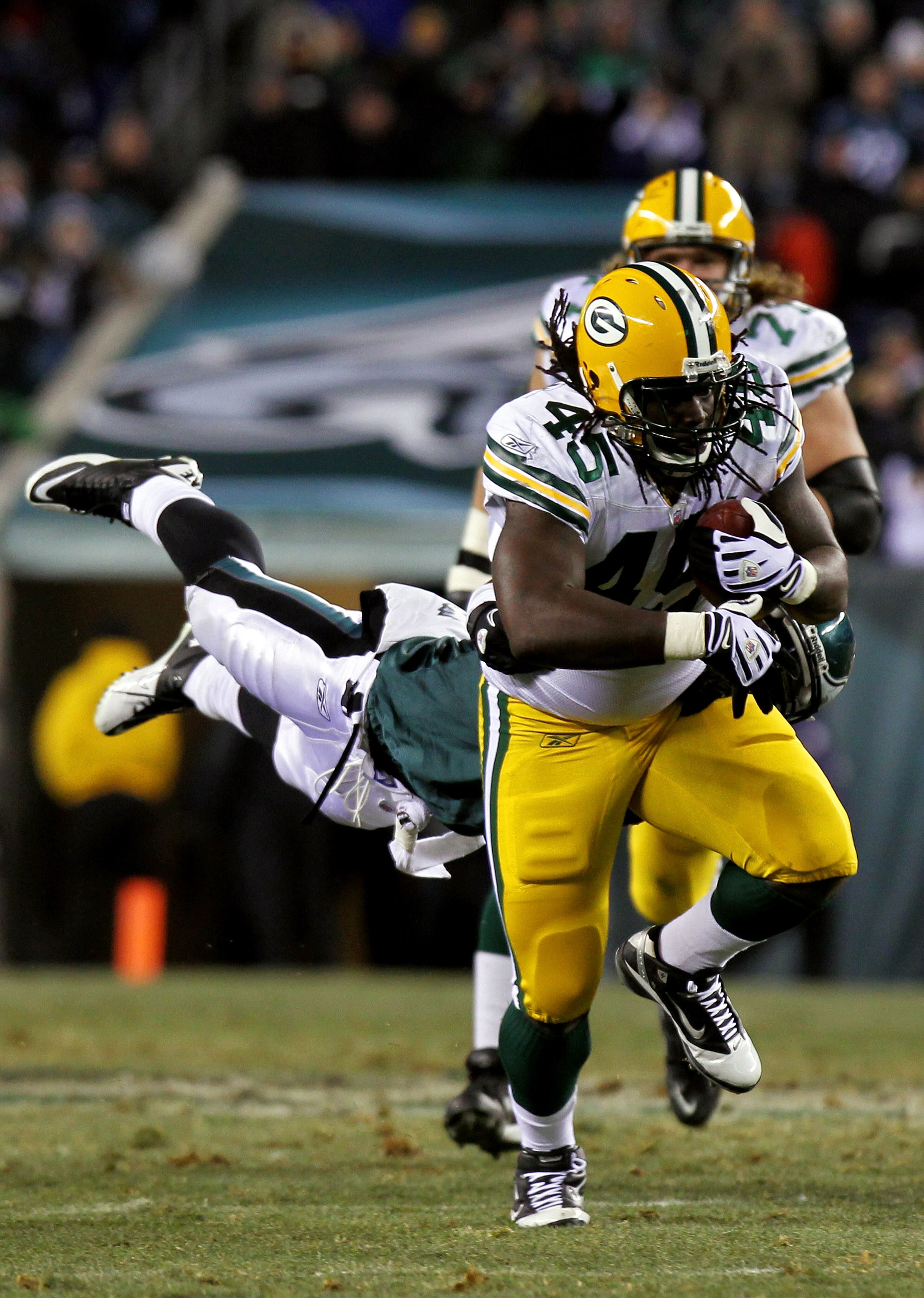 PHILADELPHIA, PA - JANUARY 09: James Starks #44 of the Green Bay Packers runs through the tackle of Ernie Sims #50 of the Philadelphia Eagles during the 2011 NFC wild card playoff game at Lincoln Financial Field on January 9, 2011 in Philadelphia, Pennsy PHILADELPHIA, PA - JANUARY 09: James Starks #44 of the Green Bay Packers runs through the tackle of Ernie Sims #50 of the Philadelphia Eagles during the 2011 NFC wild card playoff game at Lincoln Financial Field on January 9, 2011 in Philadelphia, Pennsy