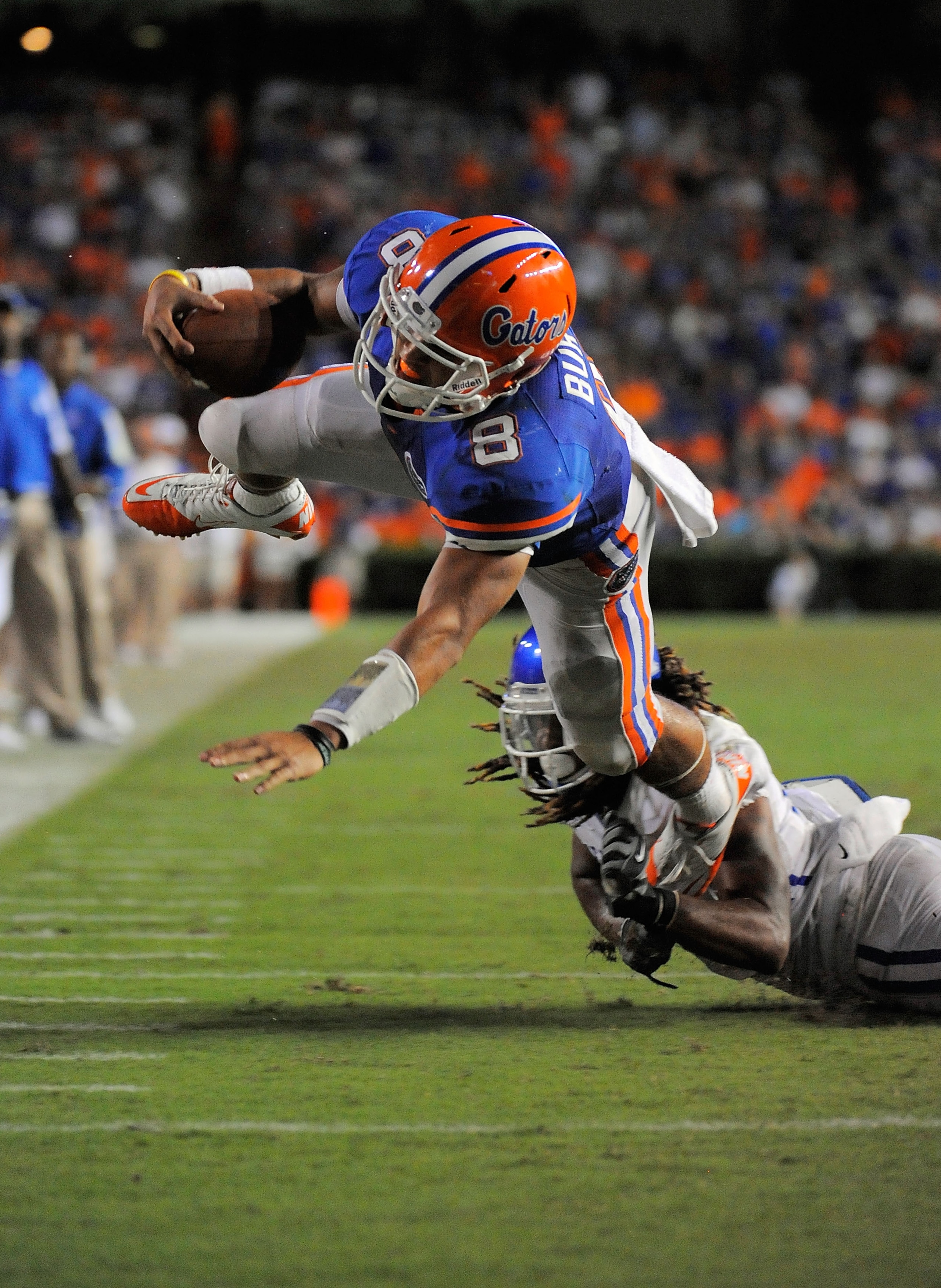 GAINESVILLE, FL - SEPTEMBER 25:  Quarterback Trey Burton #8 of the Florida Gators scores a touchdown as he is brought down by safety Winston Guy Jr. #21 of the Kentucky Wildcats at Ben Hill Griffin Stadium on September 25, 2010 in Gainesville, Florida. Fl