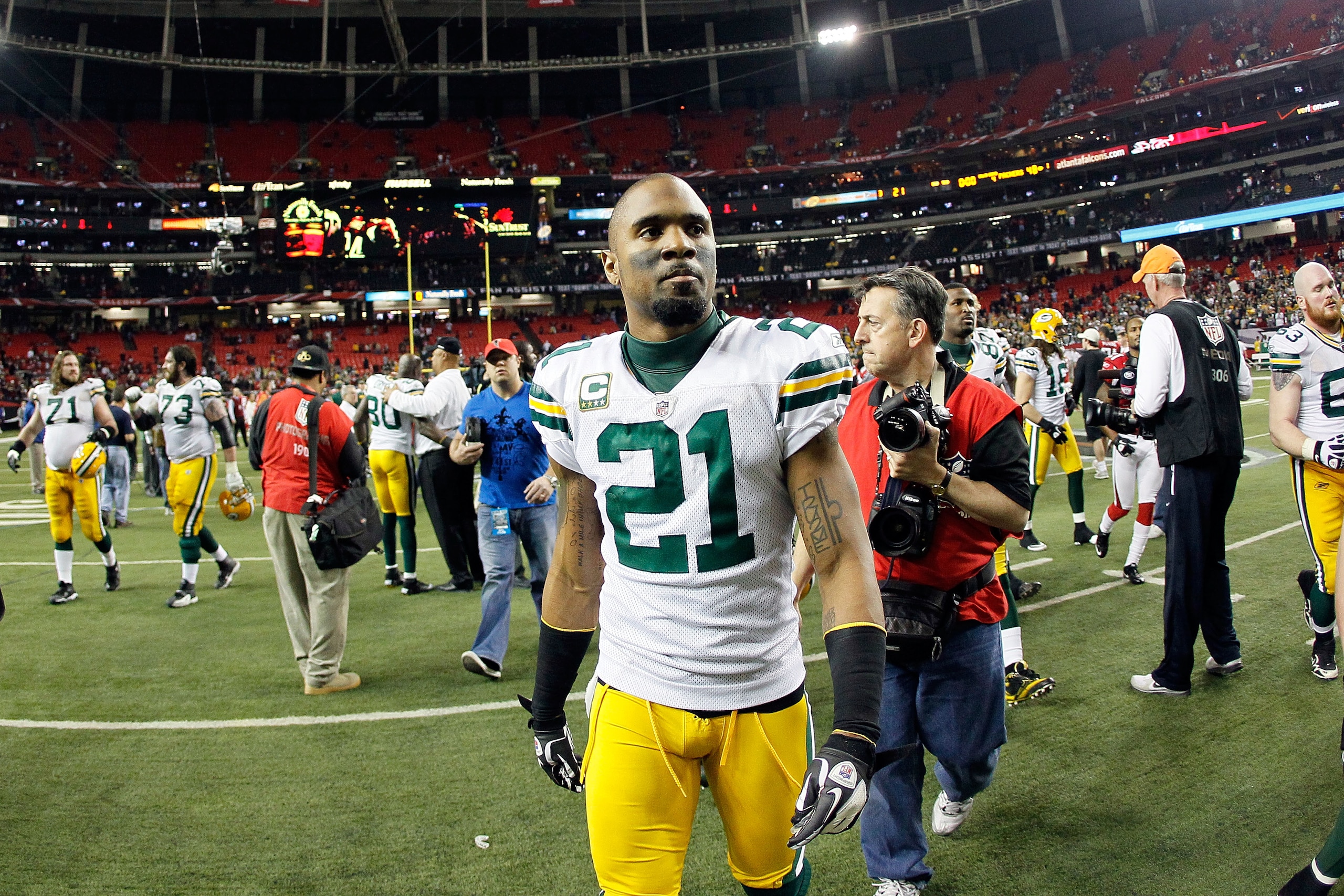 ATLANTA, GA - JANUARY 15:  Charles Woodson #21 of the Green Bay Packers walks off the field after they won 48-21 against the Atlanta Falcons during their 2011 NFC divisional playoff game at Georgia Dome on January 15, 2011 in Atlanta, Georgia.  (Photo by