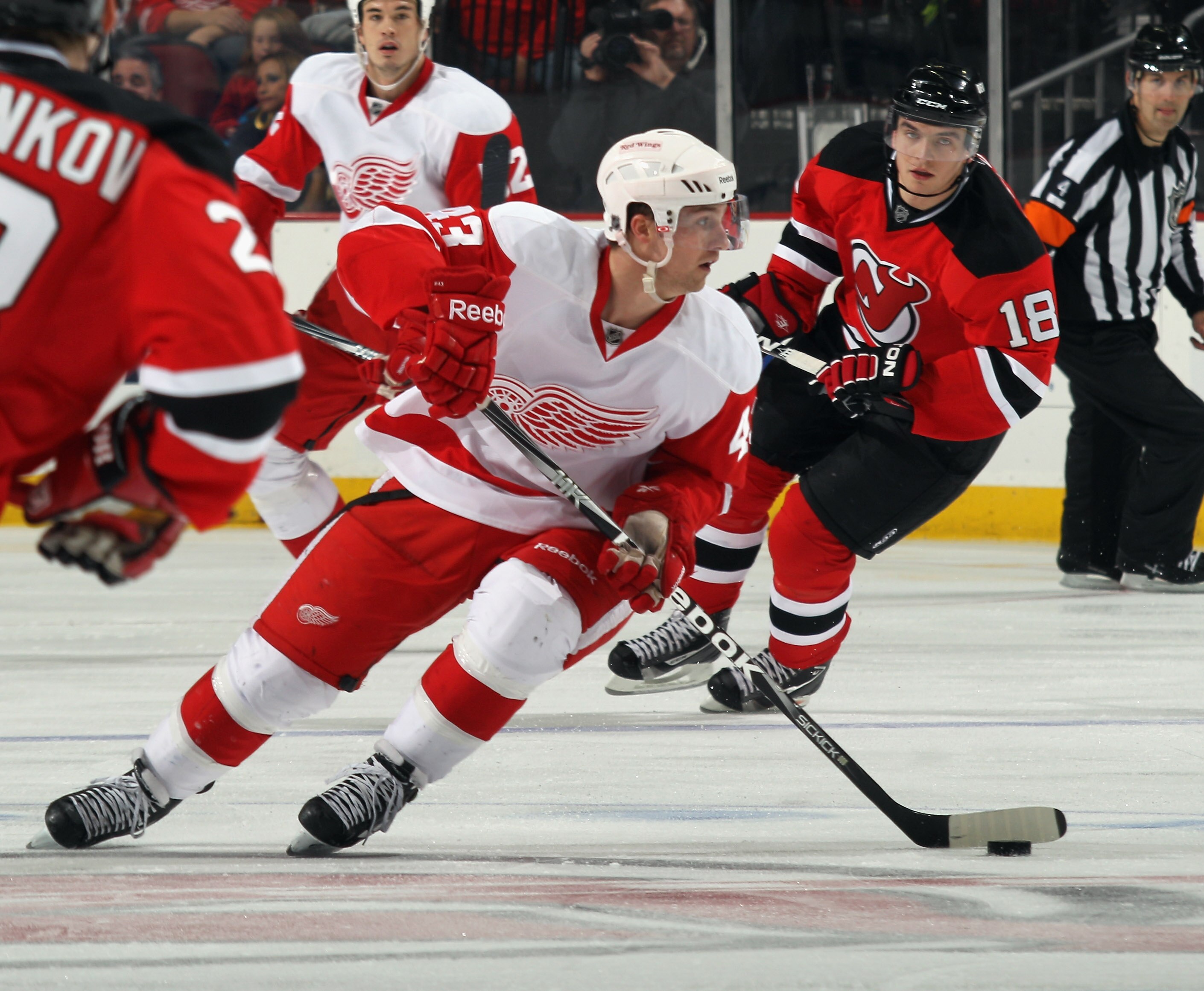 NEWARK, NJ - DECEMBER 11:  Darren Helm #43 of the Detroit Red Wings skates against the New Jersey Devils at the Prudential Center on December 11, 2010 in Newark, New Jersey. The Red Wings defeated the the Devils 4-1.  (Photo by Bruce Bennett/Getty Images)