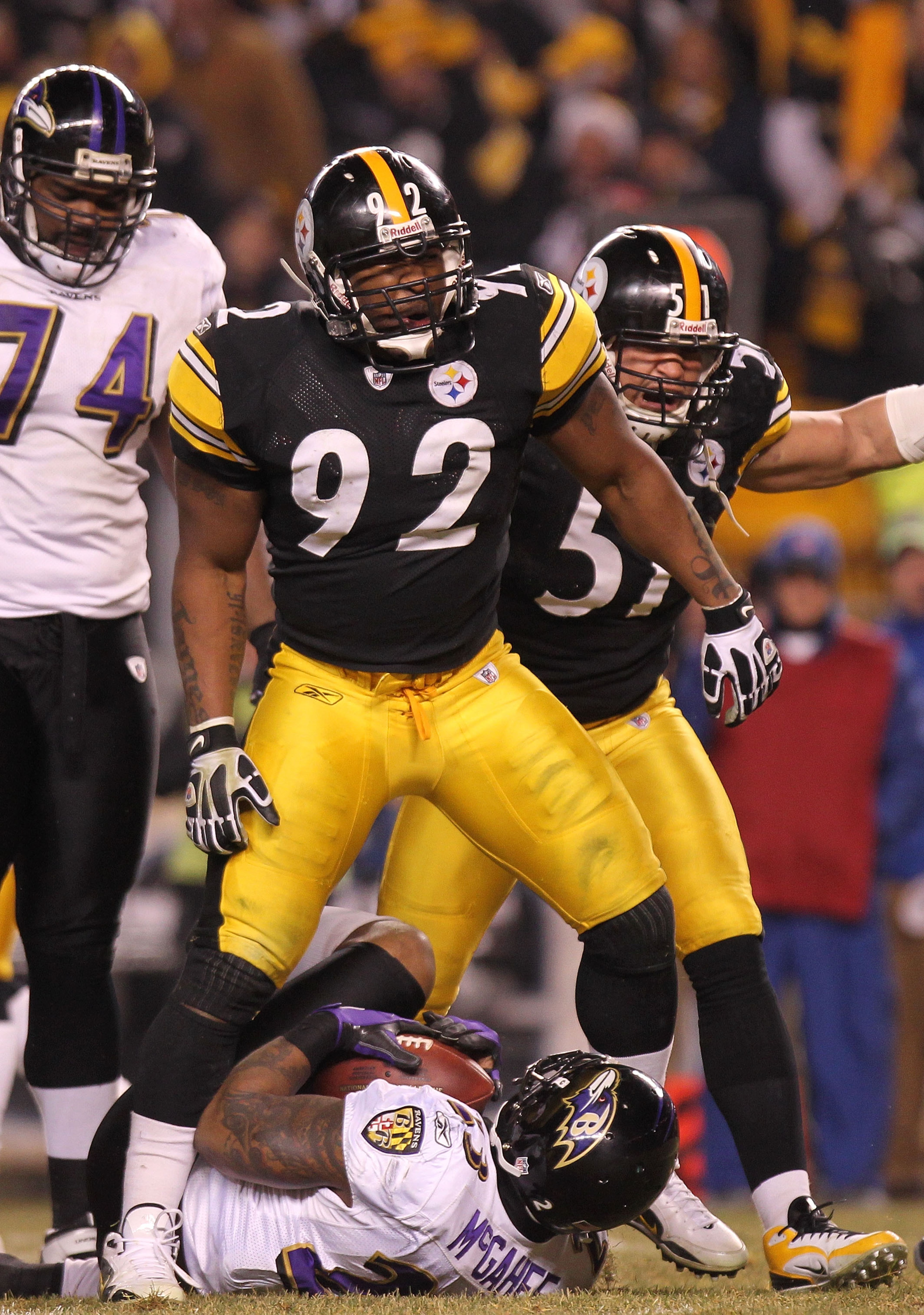 PITTSBURGH, PA - JANUARY 15: Linebacker James Harrison #92 of the Pittsburgh Steelers celebrates after stopping running back Willis McGahee #23 of the Baltimore Ravens on a play during the AFC Divisional Playoff Game at Heinz Field on January 15, 2011 in PITTSBURGH, PA - JANUARY 15: Linebacker James Harrison #92 of the Pittsburgh Steelers celebrates after stopping running back Willis McGahee #23 of the Baltimore Ravens on a play during the AFC Divisional Playoff Game at Heinz Field on January 15, 2011 in