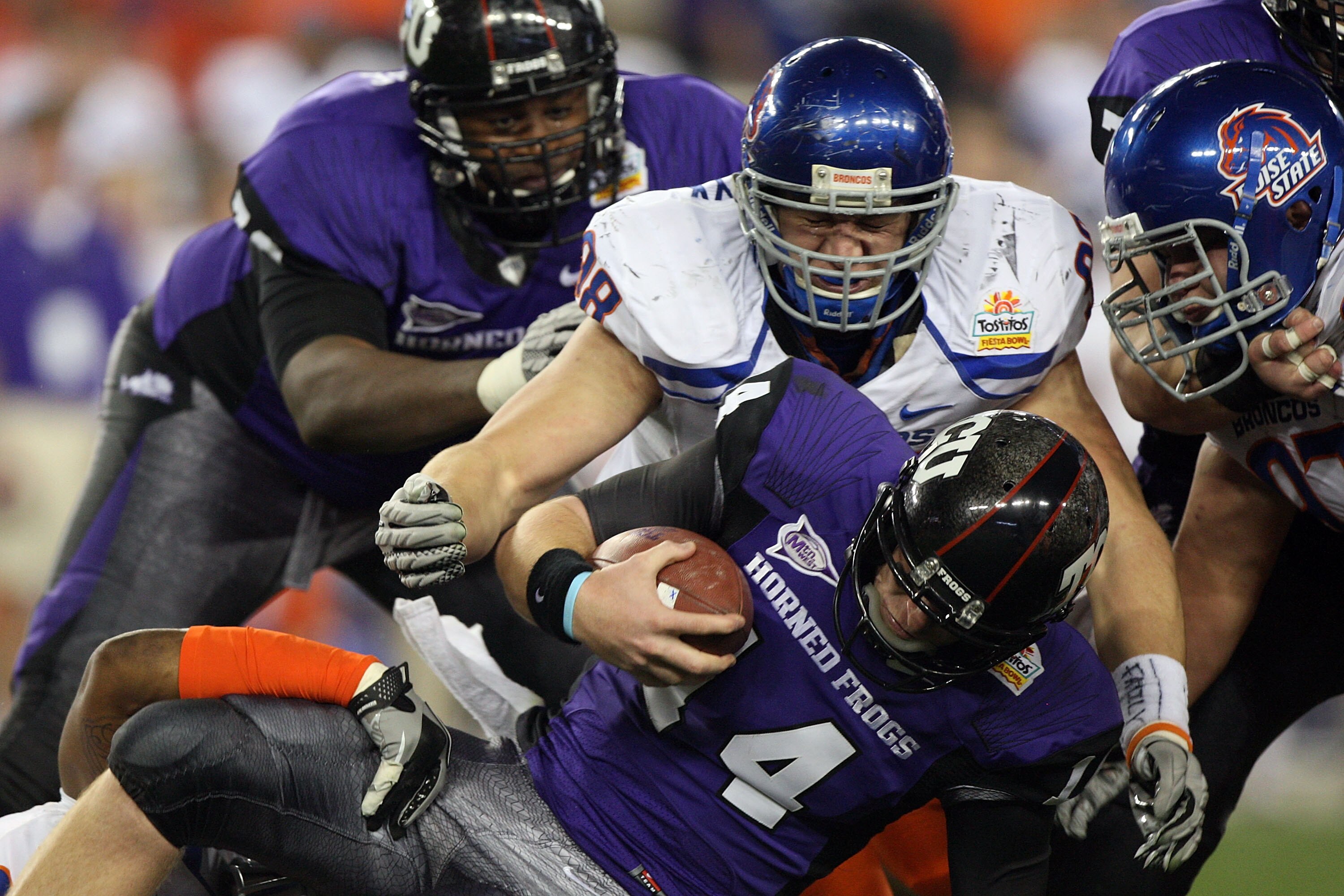 GLENDALE, AZ - JANUARY 04:  Ryan Winterswyk #98 of the Boise State Broncos tackles quarterback Andy Dalton #14 of the TCU Horned Frogs on a quarterback keeper in the third quarter during the Tostitos Fiesta Bowl at the Universtity of Phoenix Stadium on Ja