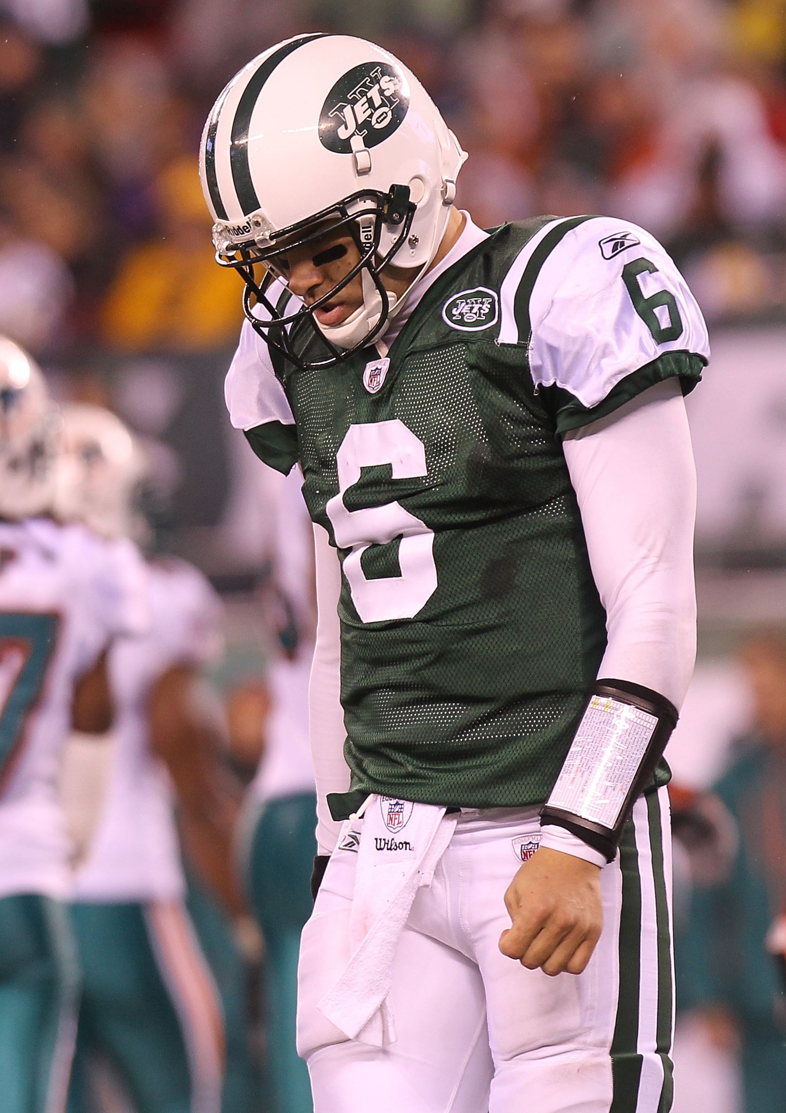 EAST RUTHERFORD, NJ - DECEMBER 12:  Mark Sanchez #6 of the New York Jets walks from the field after failing to convert a fourth down against the Miami Dolphins at New Meadowlands Stadium on December 12, 2010 in East Rutherford, New Jersey.  (Photo by Nick