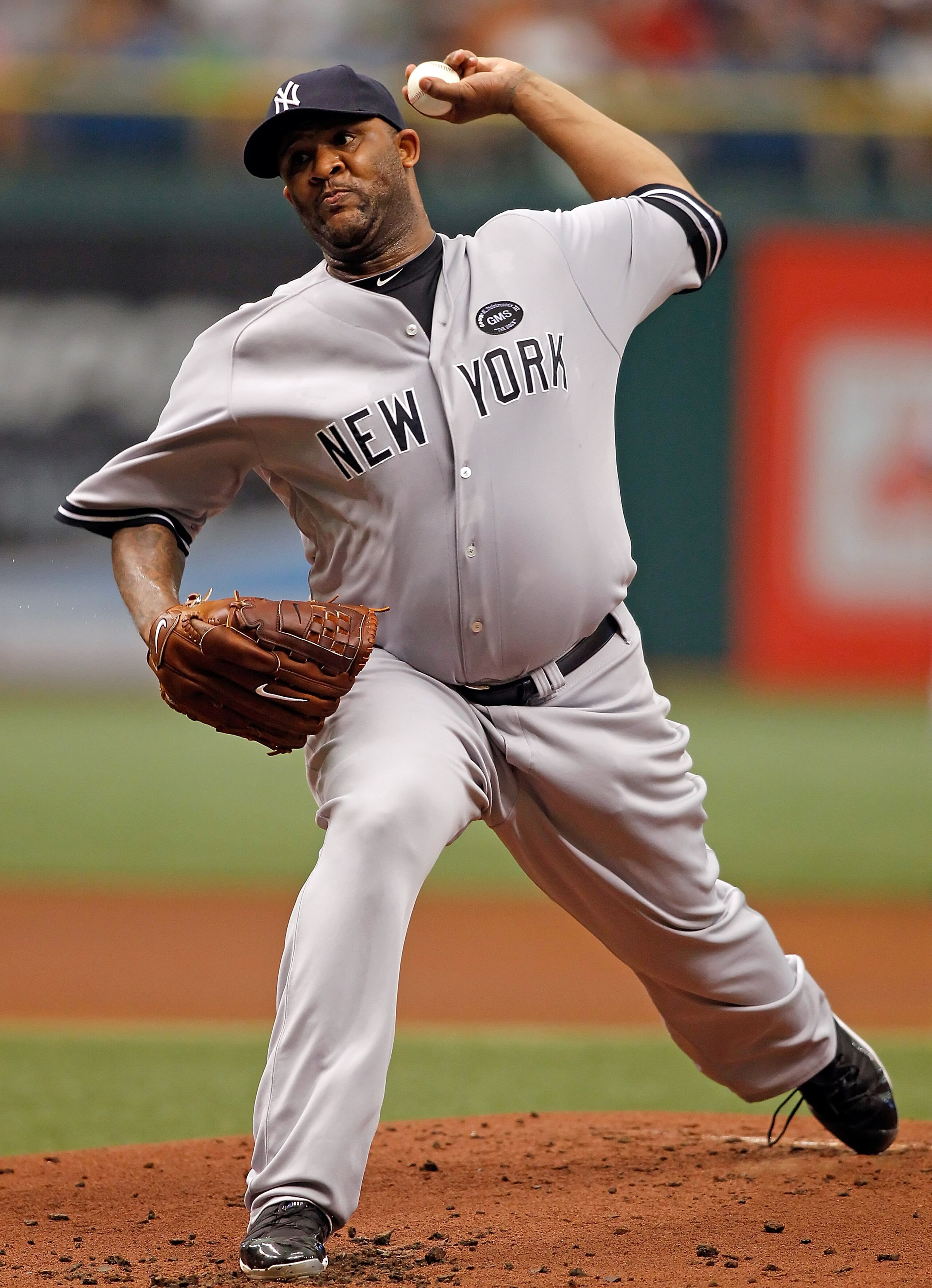 ST. PETERSBURG - AUGUST 01:  Pitcher CC Sabathia #52 of the New York Yankees pitches against the Tampa Bay Rays during the game at Tropicana Field on August 1, 2010 in St. Petersburg, Florida.  (Photo by J. Meric/Getty Images)