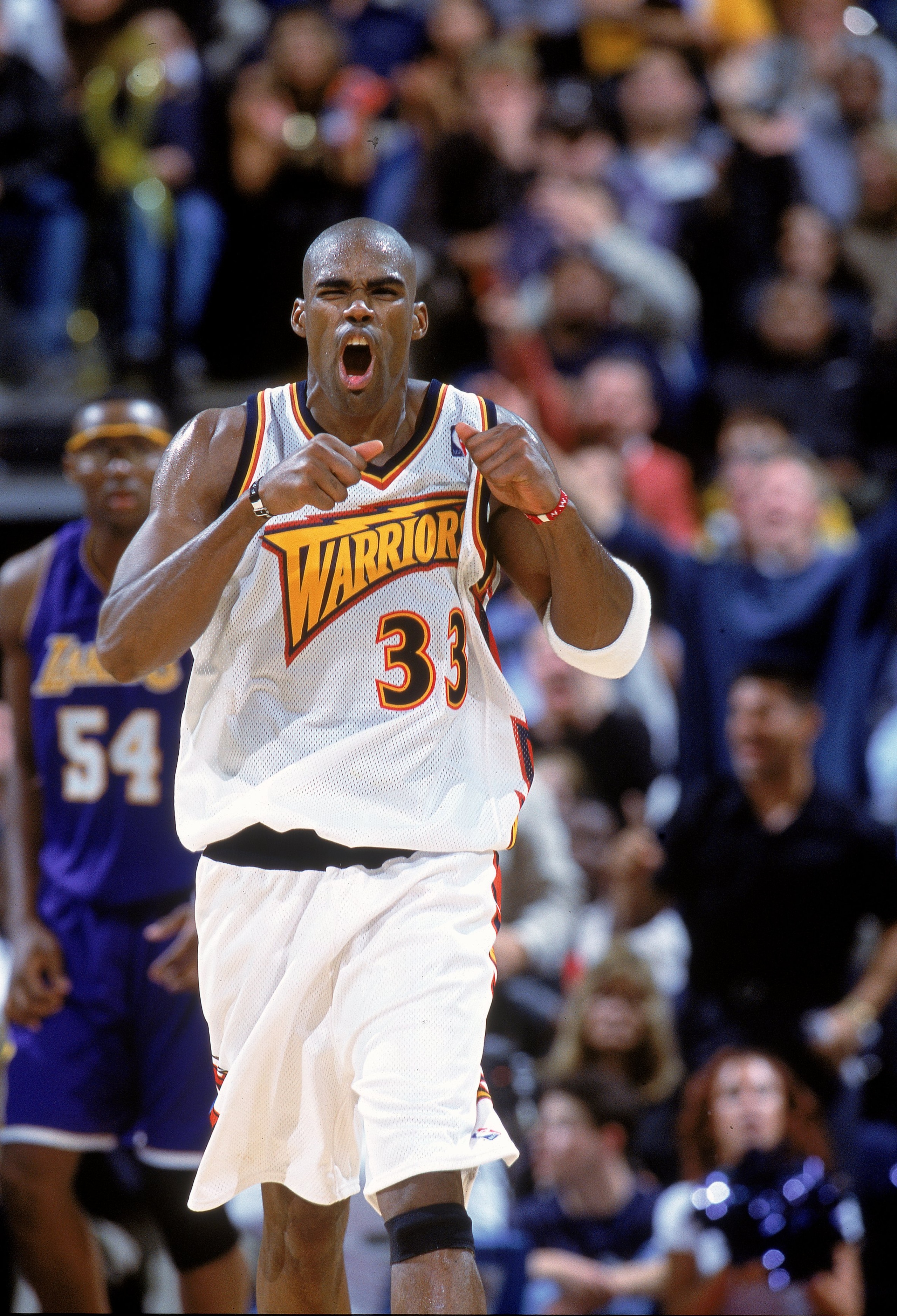 6 Dec 2000:  Antawn Jamison #33 of the Golden State Warriors celebrate as he runs down the court during the game against the Los Angeles Lakers at the Arena in Oakland, California. The Warriors defeated the Lakers 125-122. NOTE TO USER: It is expressly un