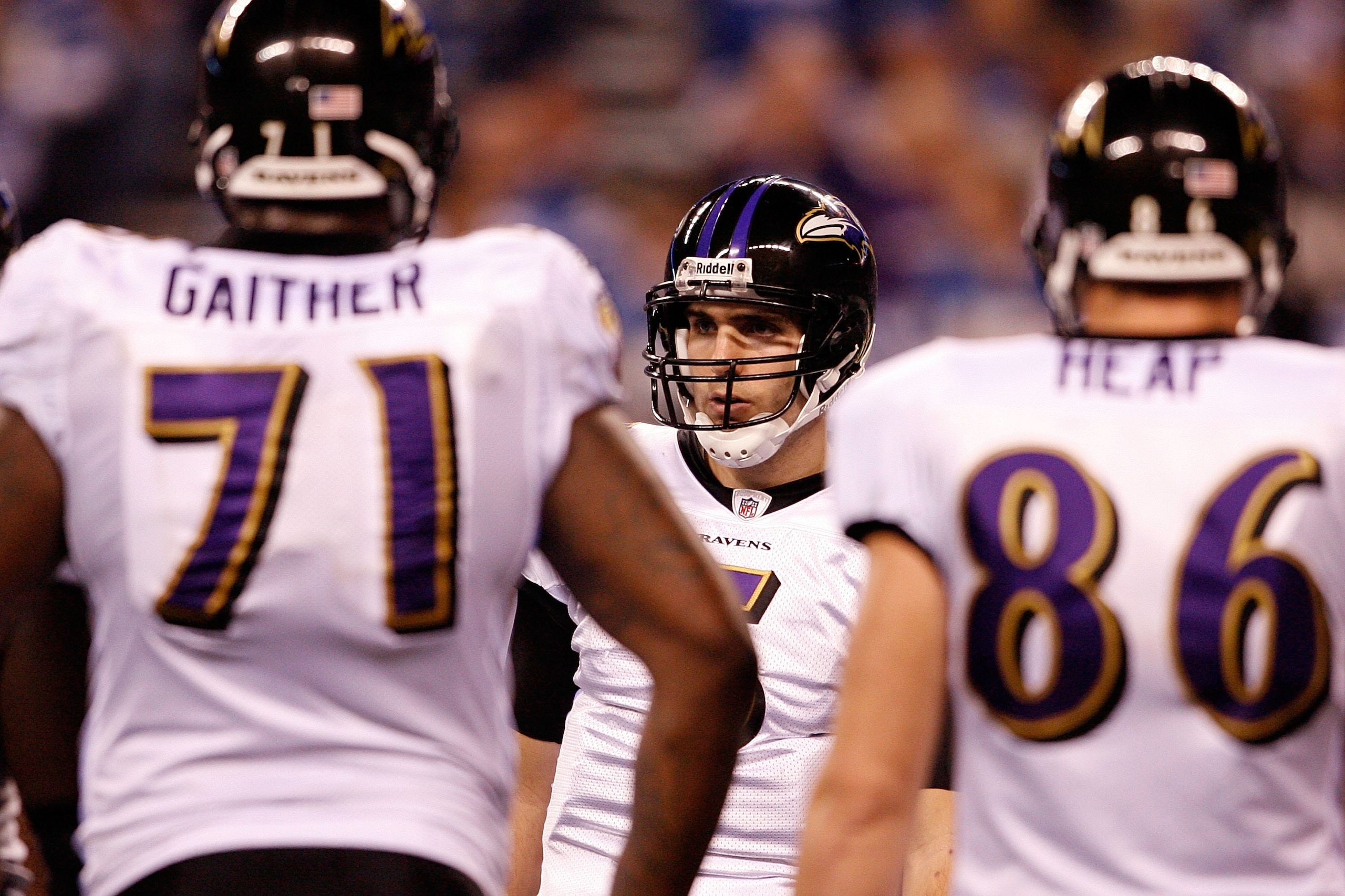 INDIANAPOLIS - JANUARY 16: Quarterback Joe Flacco #5 of the Baltimore Ravens huddles with teammates against the Indianapolis Colts in the AFC Divisional Playoff Game at Lucas Oli Stadium on January 16, 2010 in Indianapolis, Indiana. (Photo by Andy Lyons INDIANAPOLIS - JANUARY 16: Quarterback Joe Flacco #5 of the Baltimore Ravens huddles with teammates against the Indianapolis Colts in the AFC Divisional Playoff Game at Lucas Oli Stadium on January 16, 2010 in Indianapolis, Indiana. (Photo by Andy Lyons
