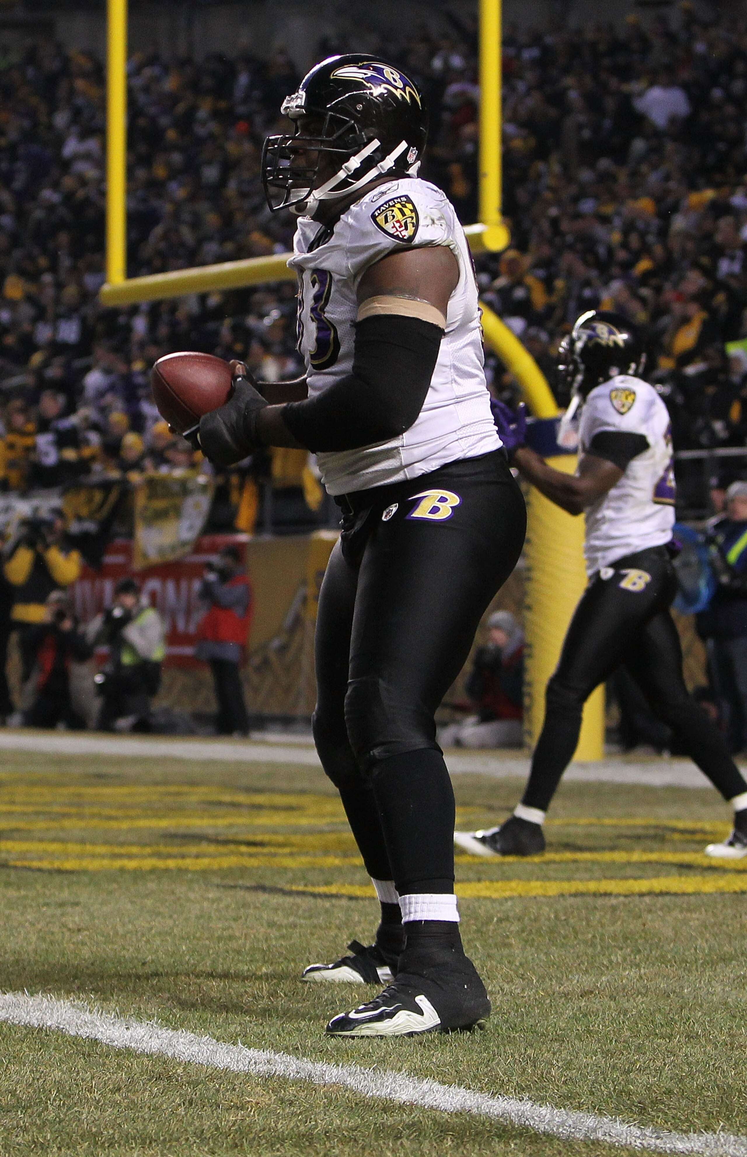 PITTSBURGH, PA - JANUARY 15:  Defensive end Cory Redding #93 of the Baltimore Ravens stands in the end zone after scoring on a fumble by the Pittsburgh Steelers during the AFC Divisional Playoff Game at Heinz Field on January 15, 2011 in Pittsburgh, Penns