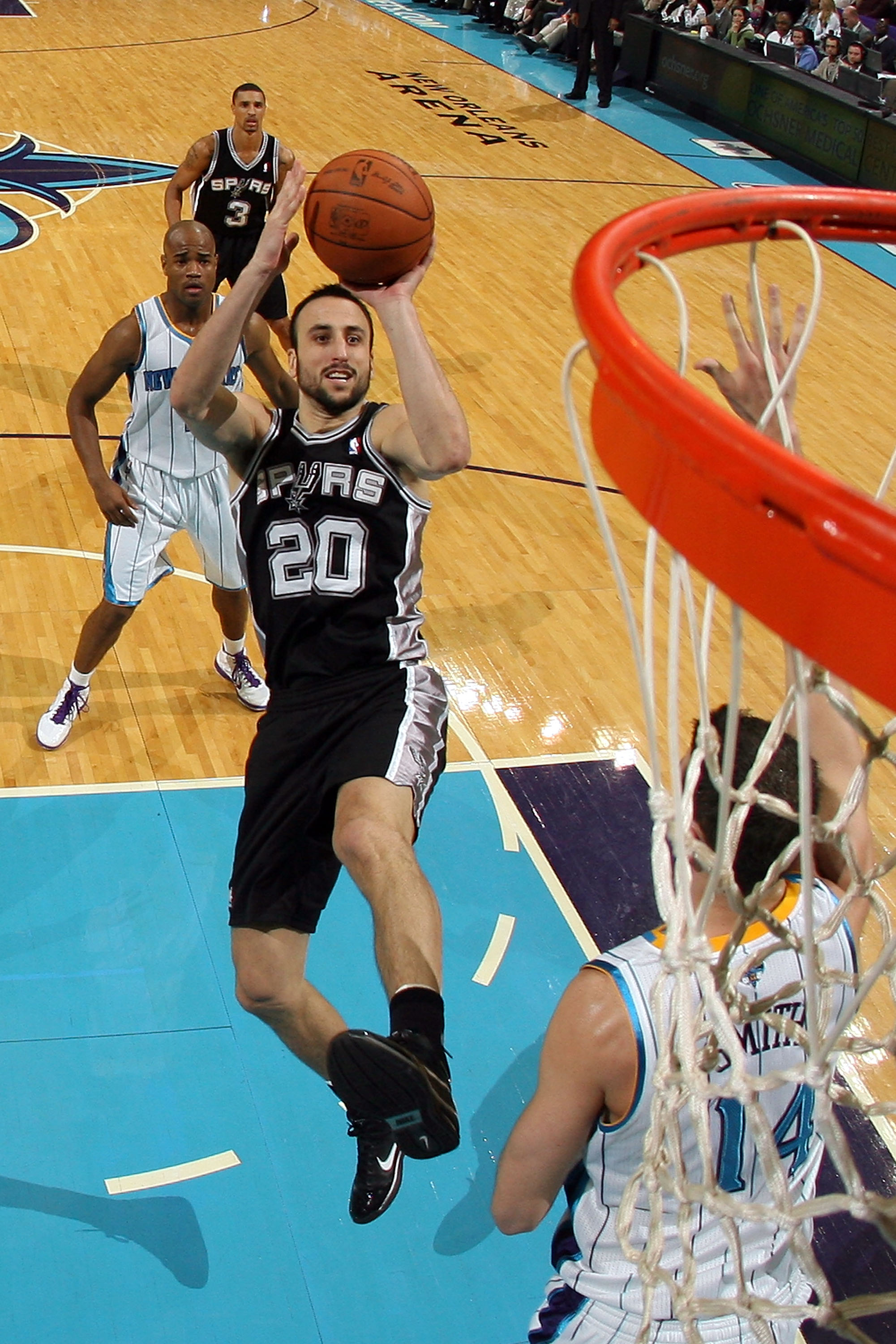 NEW ORLEANS - NOVEMBER 28:  Manu Ginobili #20 of the San Antonio Spurs shoots the ball over Jason Smith #14 of the New Orleans Hornets at the New Orleans Arena on November 28, 2010 in New Orleans, Louisiana.  The Spurs defeated the Hornets 109-95.  NOTE T