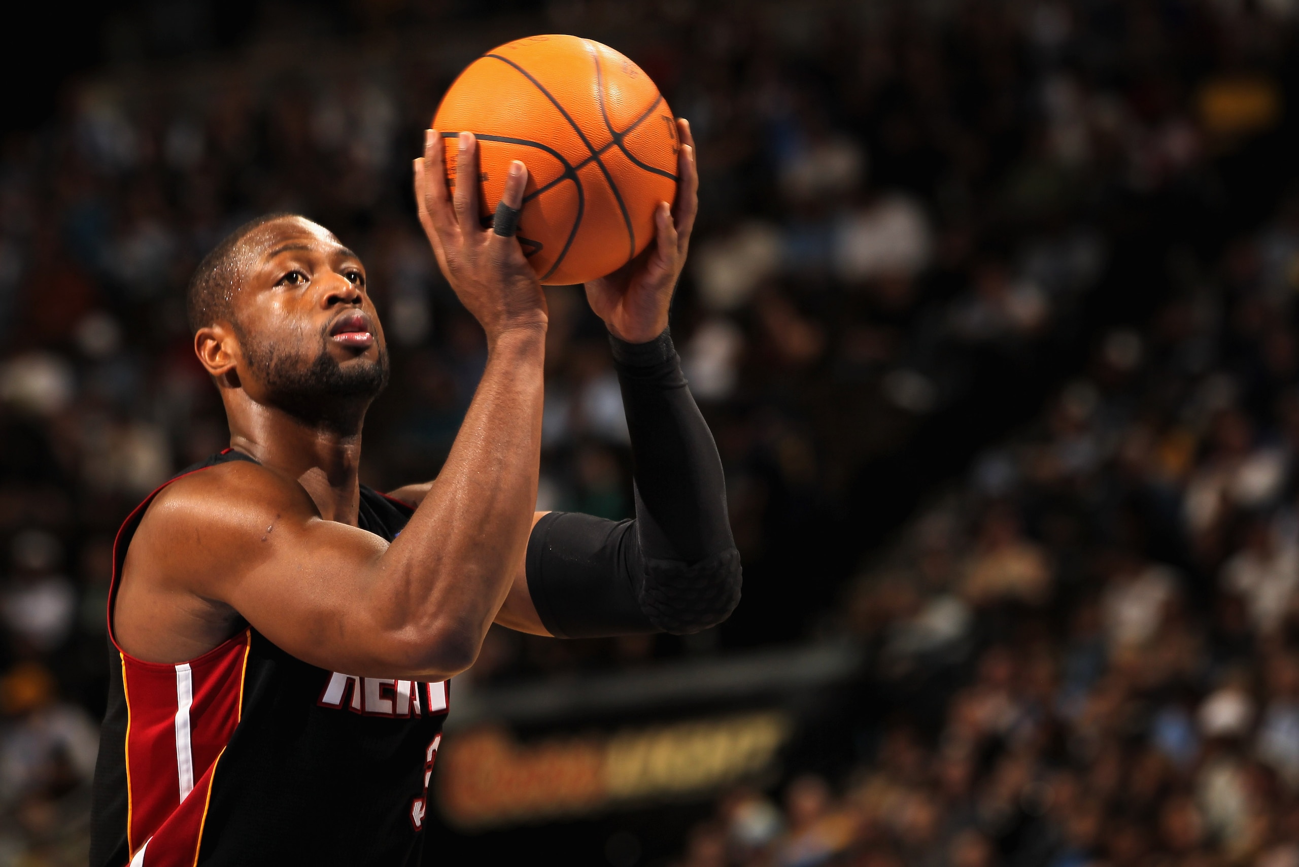 DENVER, CO - JANUARY 13:  Dwayne Wade #3 of the Miami Heat takes a free throw against the Denver Nuggets at the Pepsi Center on January 13, 2011 in Denver, Colorado. The Nuggets defeated the Heat 130-102. NOTE TO USER: User expressly acknowledges and agre