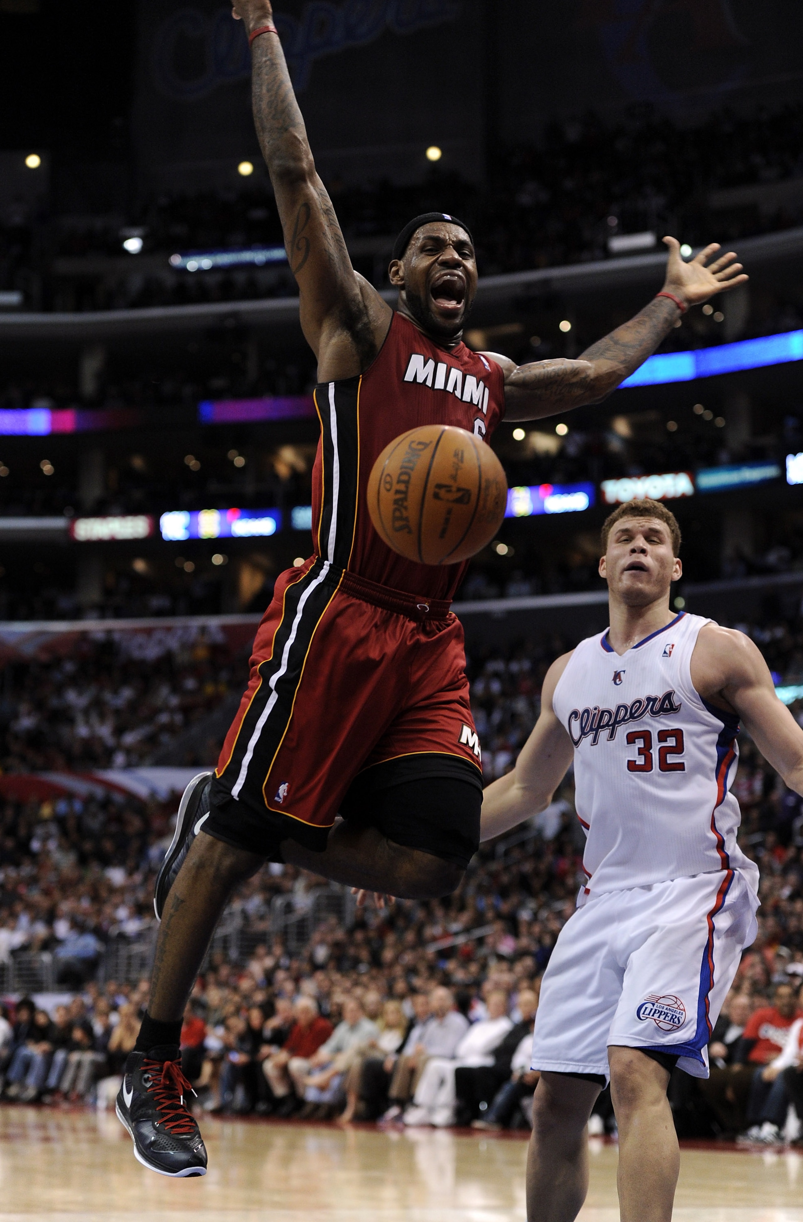LOS ANGELES, CA - JANUARY 12:  LeBron James #6 of the Miami Heat is fouled by Blake Griffin #32 of the Los Angeles Clippers during a 111-105 Clipper win at the Staples Center on January 12, 2011 in Los Angeles, California.  NOTE TO USER: User expressly ac