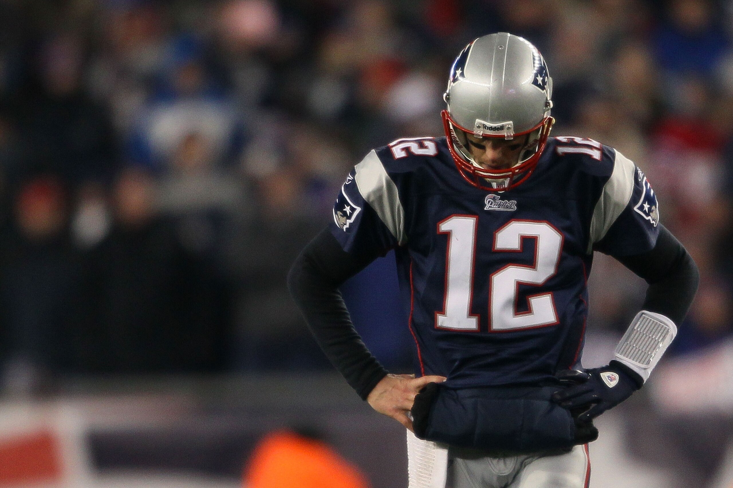 FOXBORO, MA - JANUARY 16:  Tom Brady #12 of the New England Patriots looks on near the end of their 28 to 21 loss to the New York Jets in their 2011 AFC divisional playoff game at Gillette Stadium on January 16, 2011 in Foxboro, Massachusetts.  (Photo by