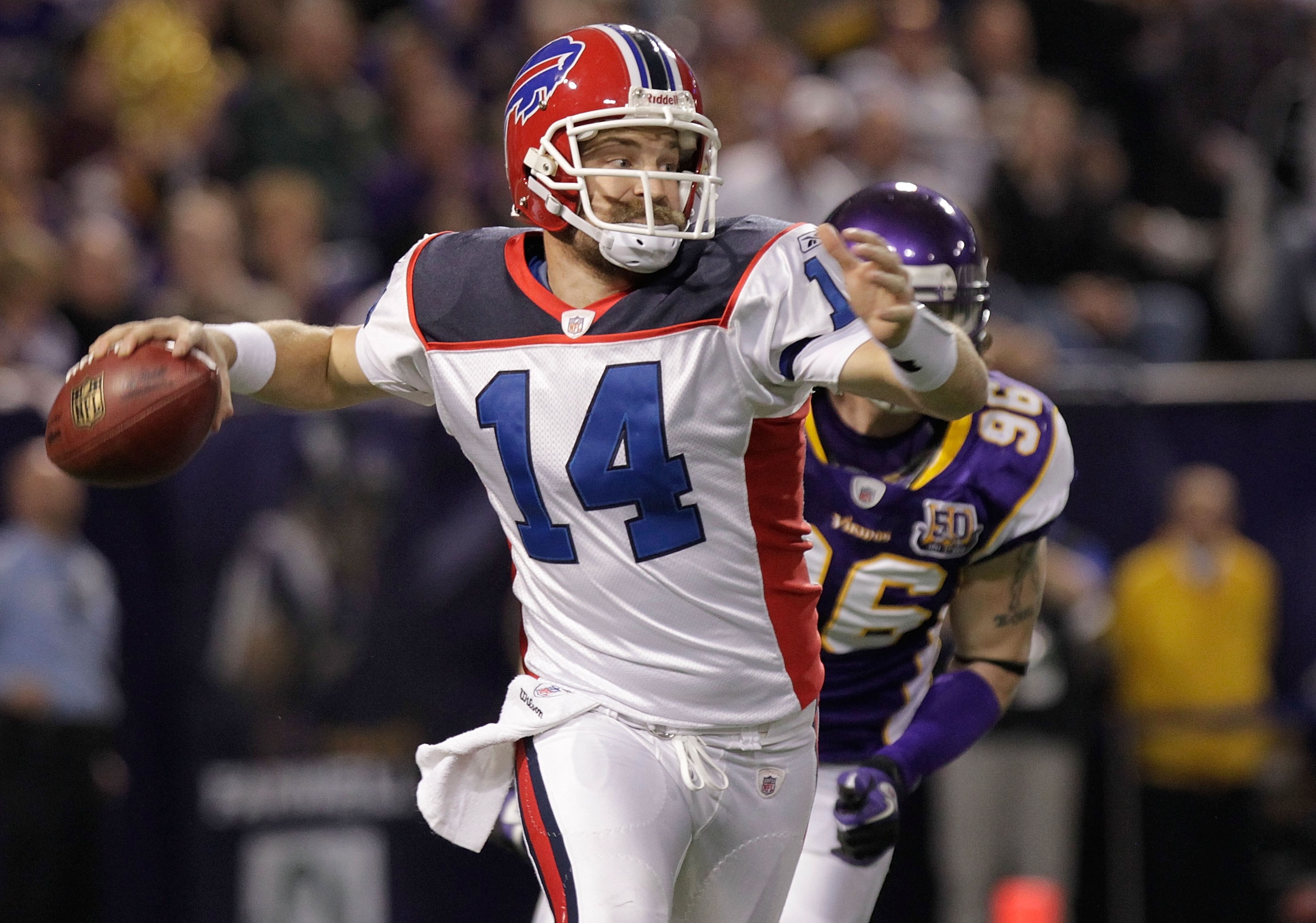 MINNEAPOLIS, MN - DECEMBER 05:  Ryan Fitzpatrick #14 of the Buffalo Bills rolls out against the Minnesota Vikings at the Mall of America Field at the Hubert H. Humphrey Metrodome on December 5, 2010 in Minneapolis, Minnesota.  (Photo by Nick Laham/Getty I