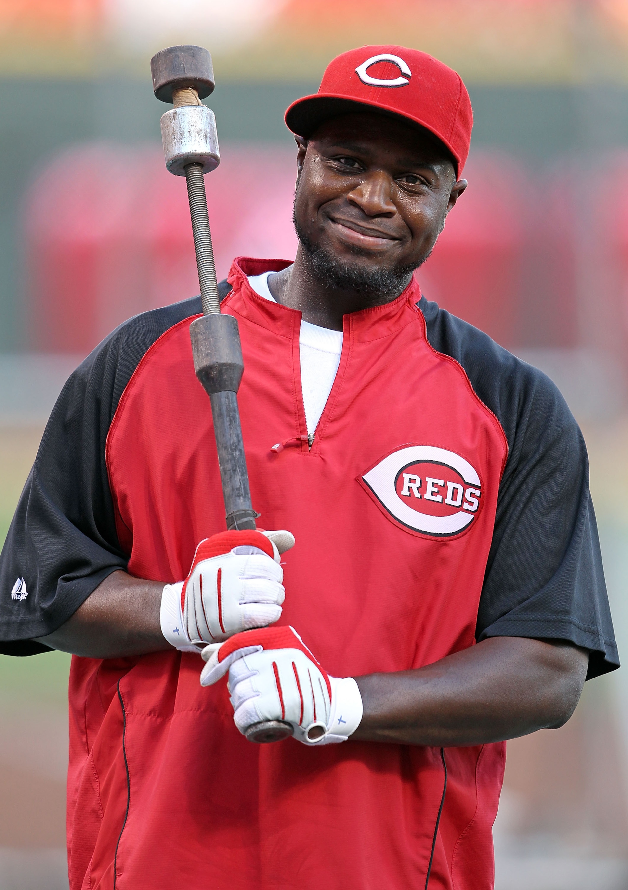CINCINNATI - OCTOBER 10:  Brandon Phillips #4 of the Cincinnati Reds participates in batting practice before the start of  Game 3 of the NLDS against the Philadelphia Phillies  at Great American Ball Park on October 10, 2010 in Cincinnati, Ohio.  (Photo b