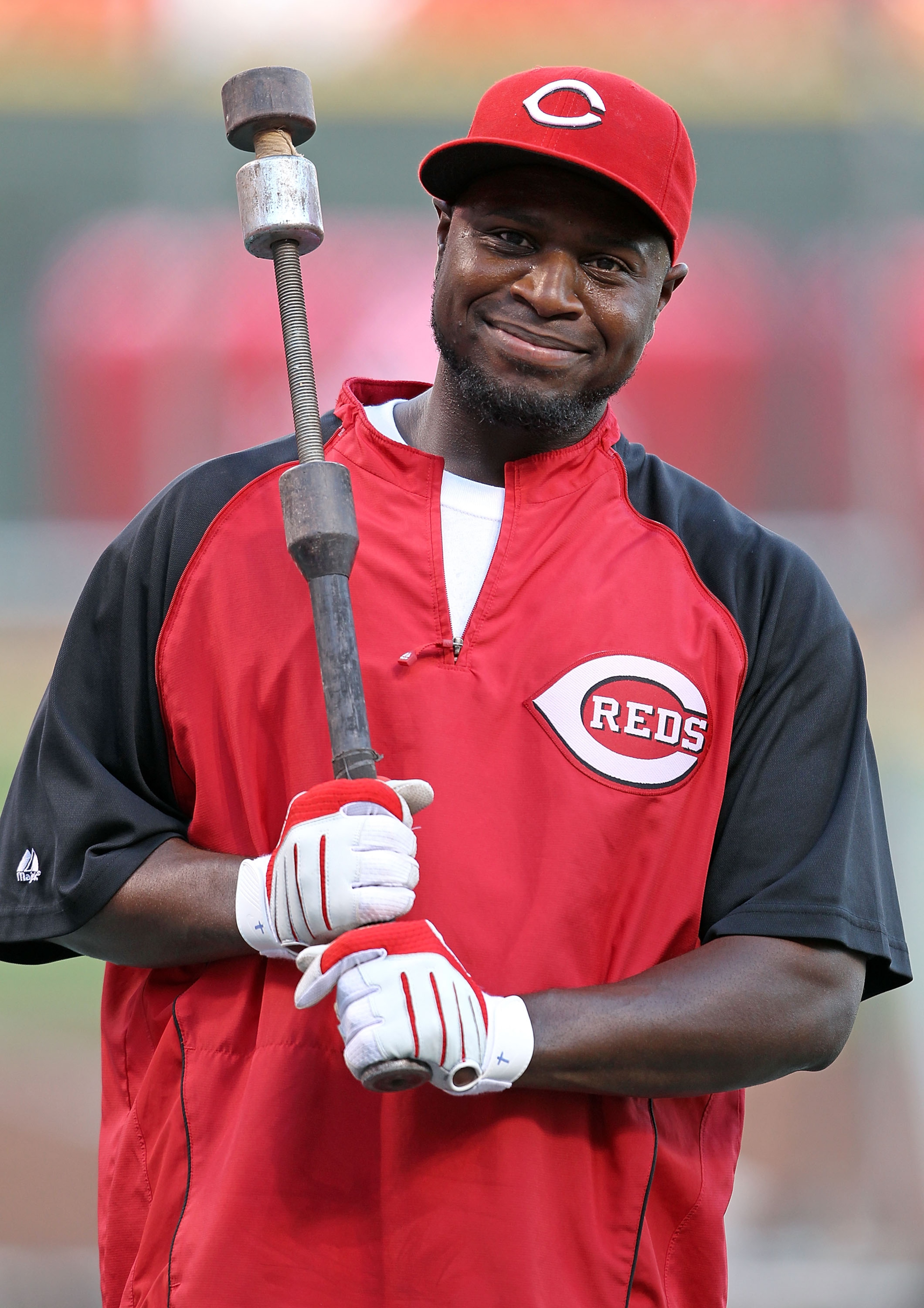 CINCINNATI - OCTOBER 10:  Brandon Phillips #4 of the Cincinnati Reds participates in batting practice before the start of  Game 3 of the NLDS against the Philadelphia Phillies  at Great American Ball Park on October 10, 2010 in Cincinnati, Ohio.  (Photo b